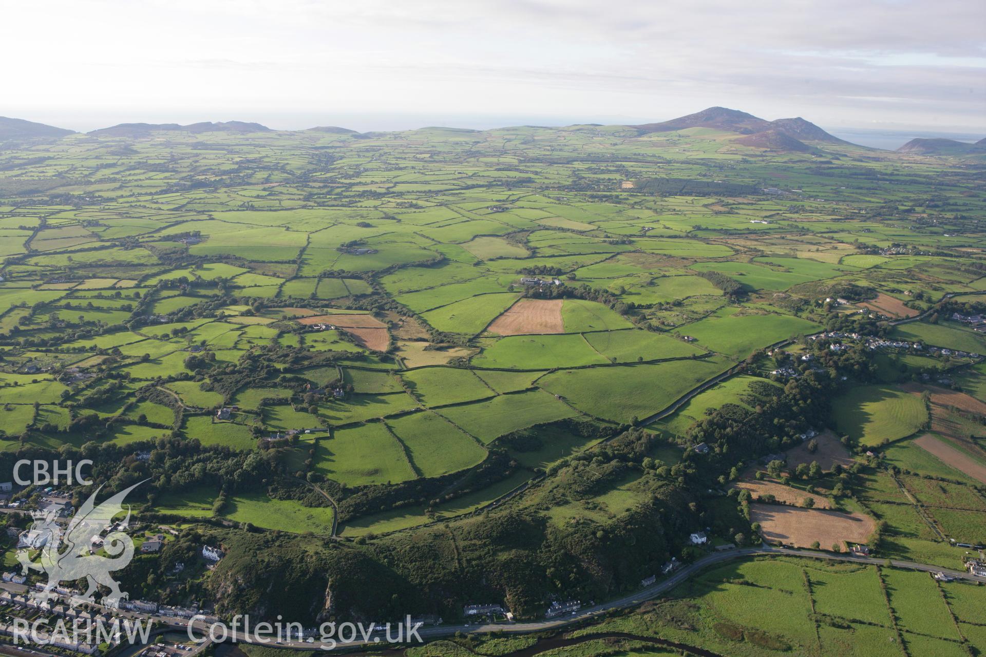 RCAHMW colour oblique aerial photograph of the landscape to the north of Pwllheli. Taken on 06 September 2007 by Toby Driver