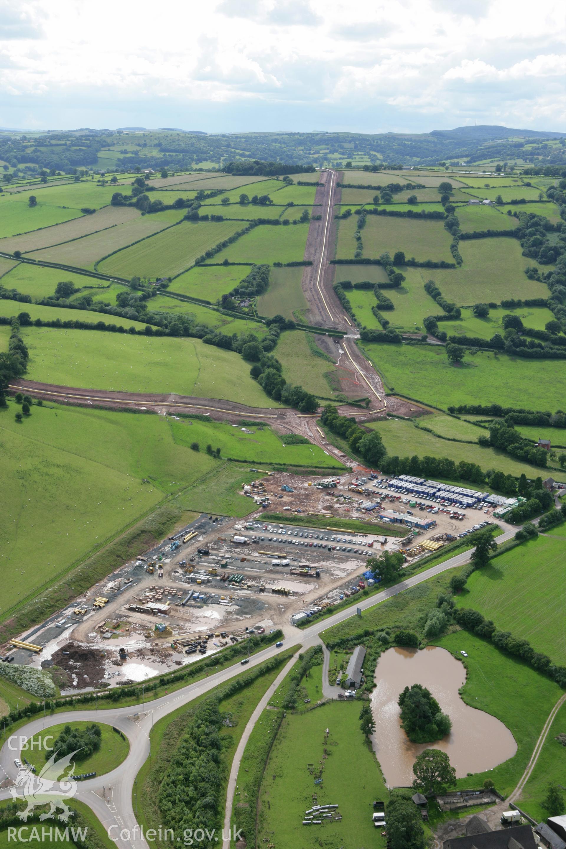 RCAHMW colour oblique aerial photograph of Llyswen Liquified Natural Gas (LNG Pipeline Depot. Taken on 09 July 2007 by Toby Driver