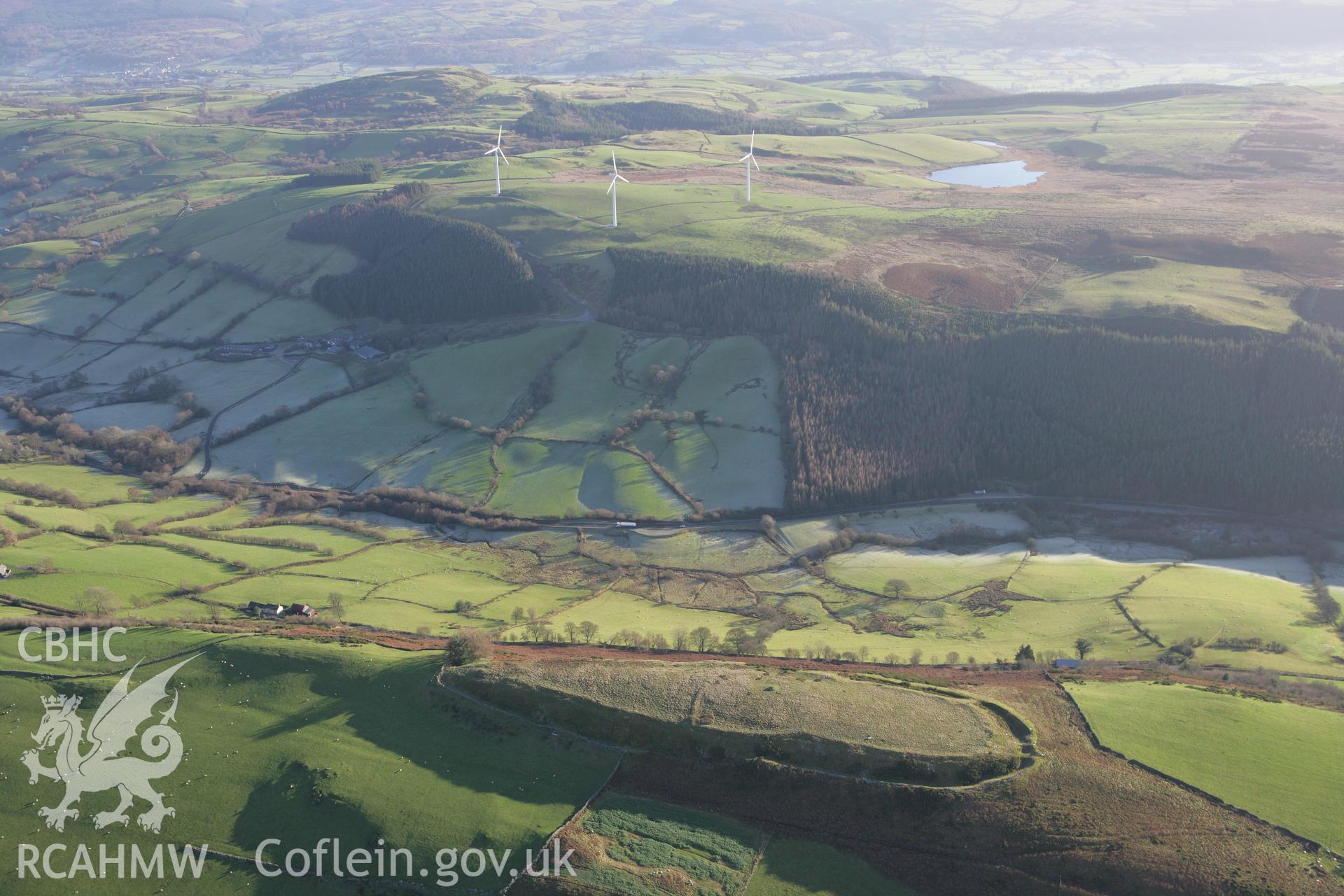 RCAHMW colour oblique photograph of Caer Euni hillfort;Carn Euni camp;Caer Eini;Caer Crwyini. Taken by Toby Driver on 11/12/2007.