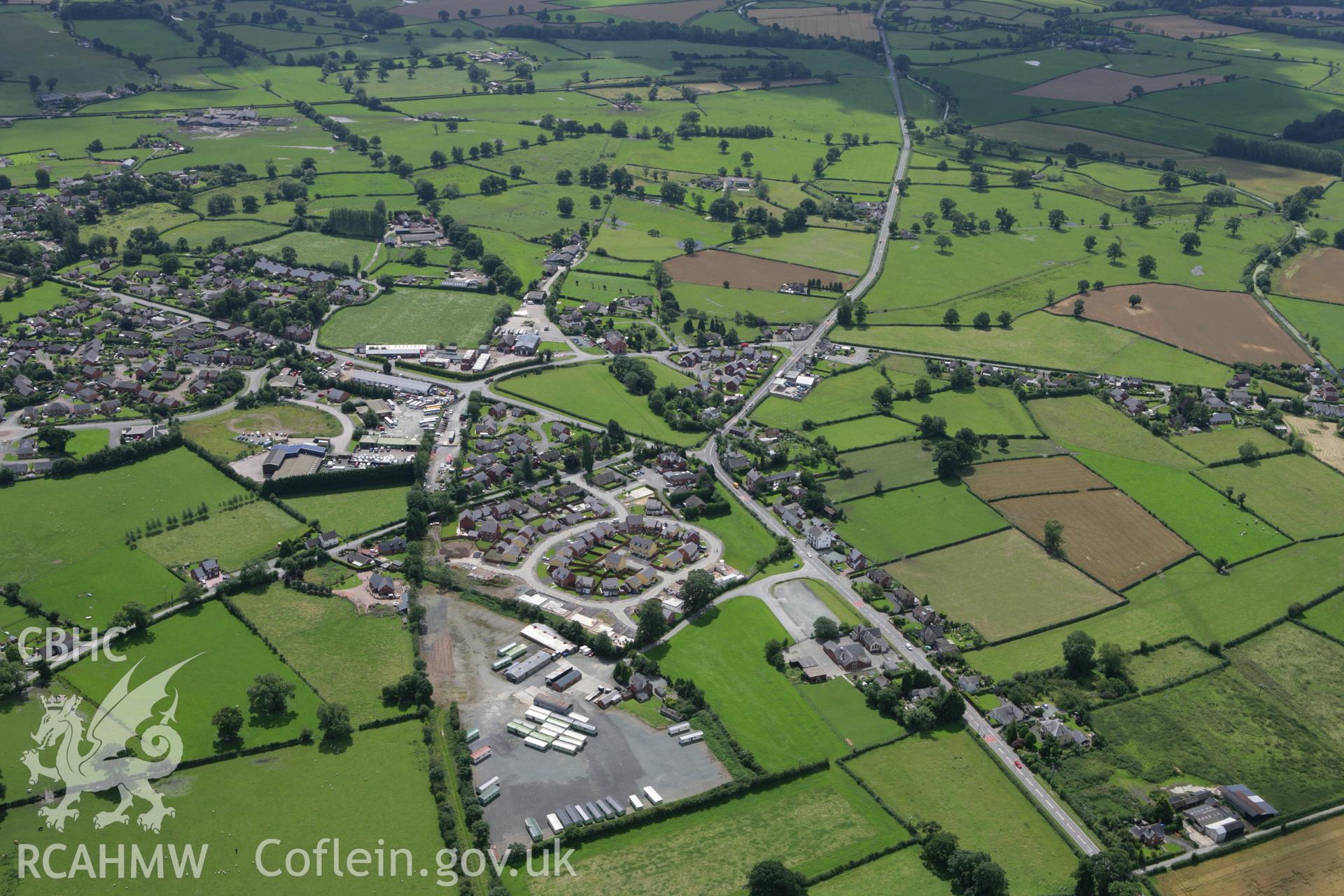 RCAHMW colour oblique aerial photograph of Four Crosses. Taken on 24 July 2007 by Toby Driver