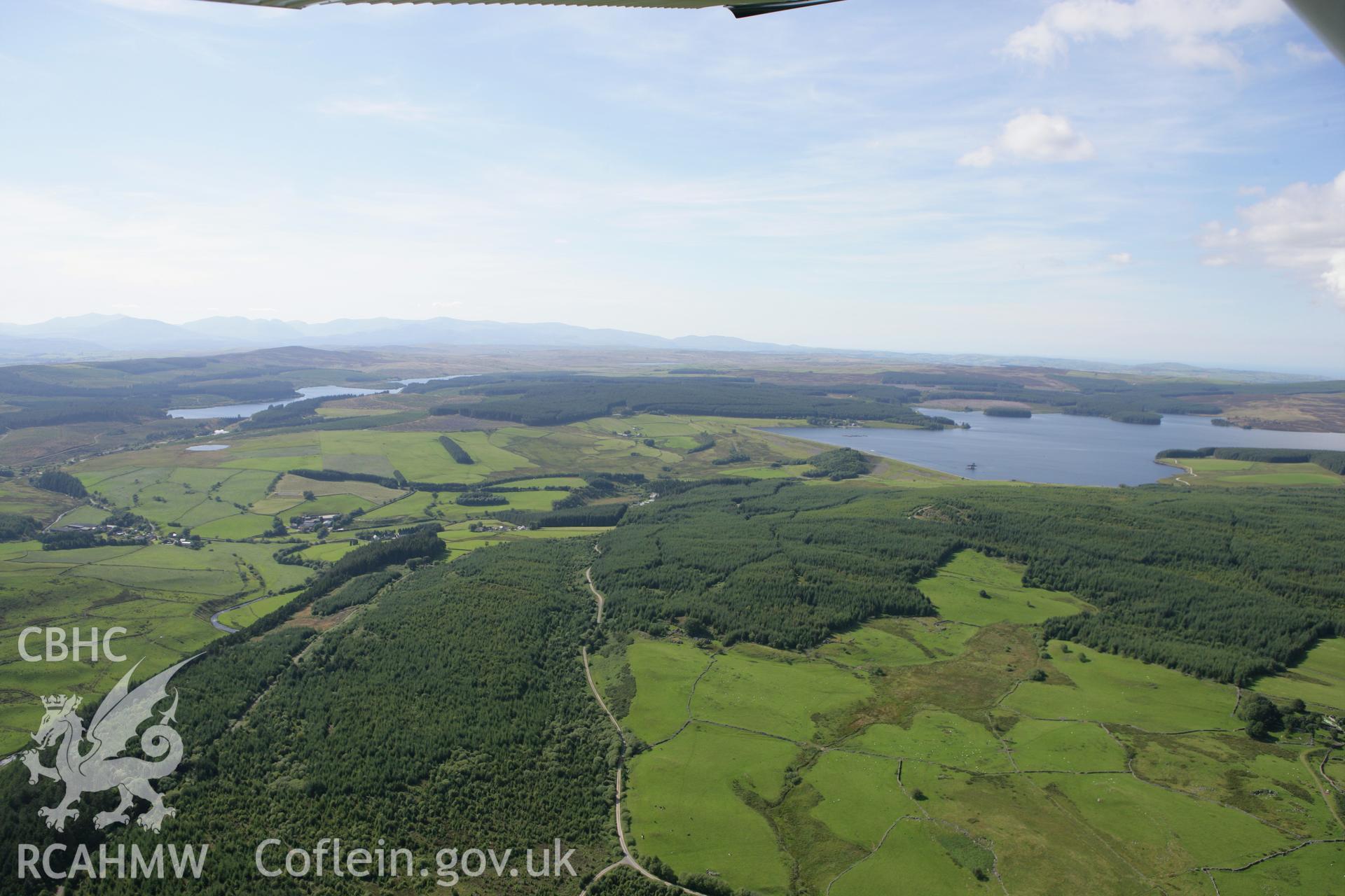RCAHMW colour oblique aerial photograph showing distant landscape of Llyn Brenig from the south-east. Taken on 31 July 2007 by Toby Driver