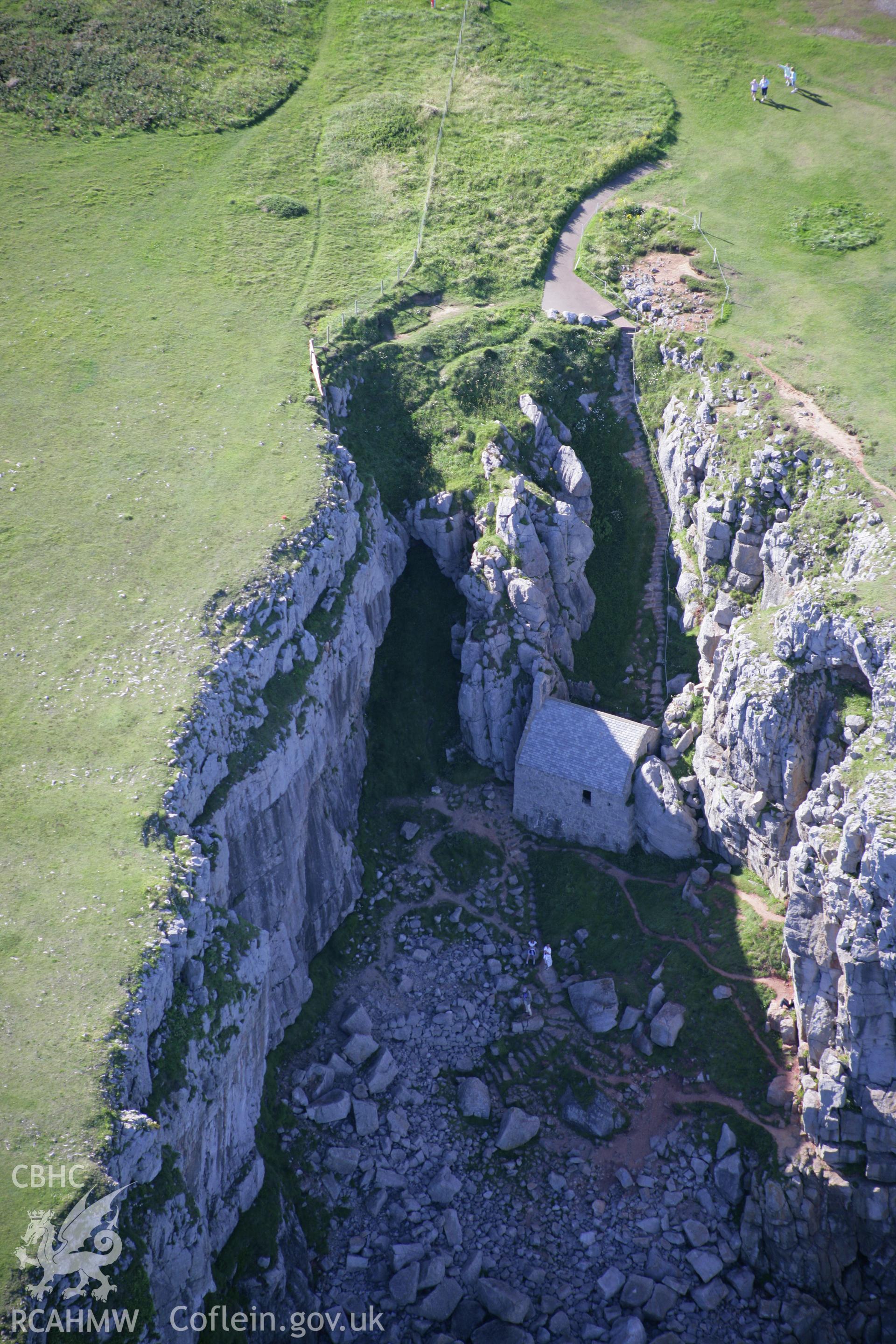 RCAHMW colour oblique aerial photograph of St Govan's Chapel. Taken on 30 July 2007 by Toby Driver