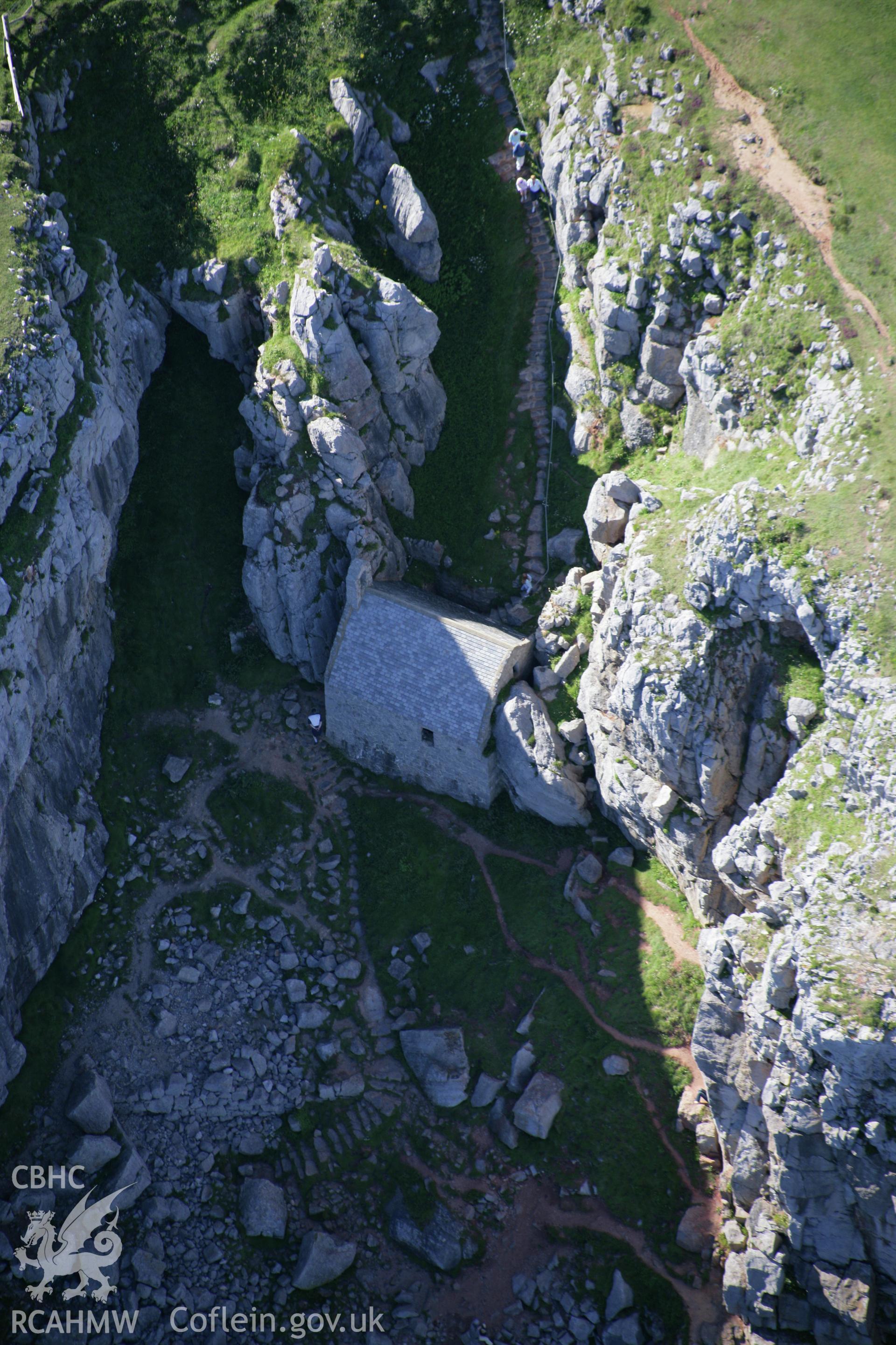 RCAHMW colour oblique aerial photograph of St Govan's Chapel. Taken on 30 July 2007 by Toby Driver