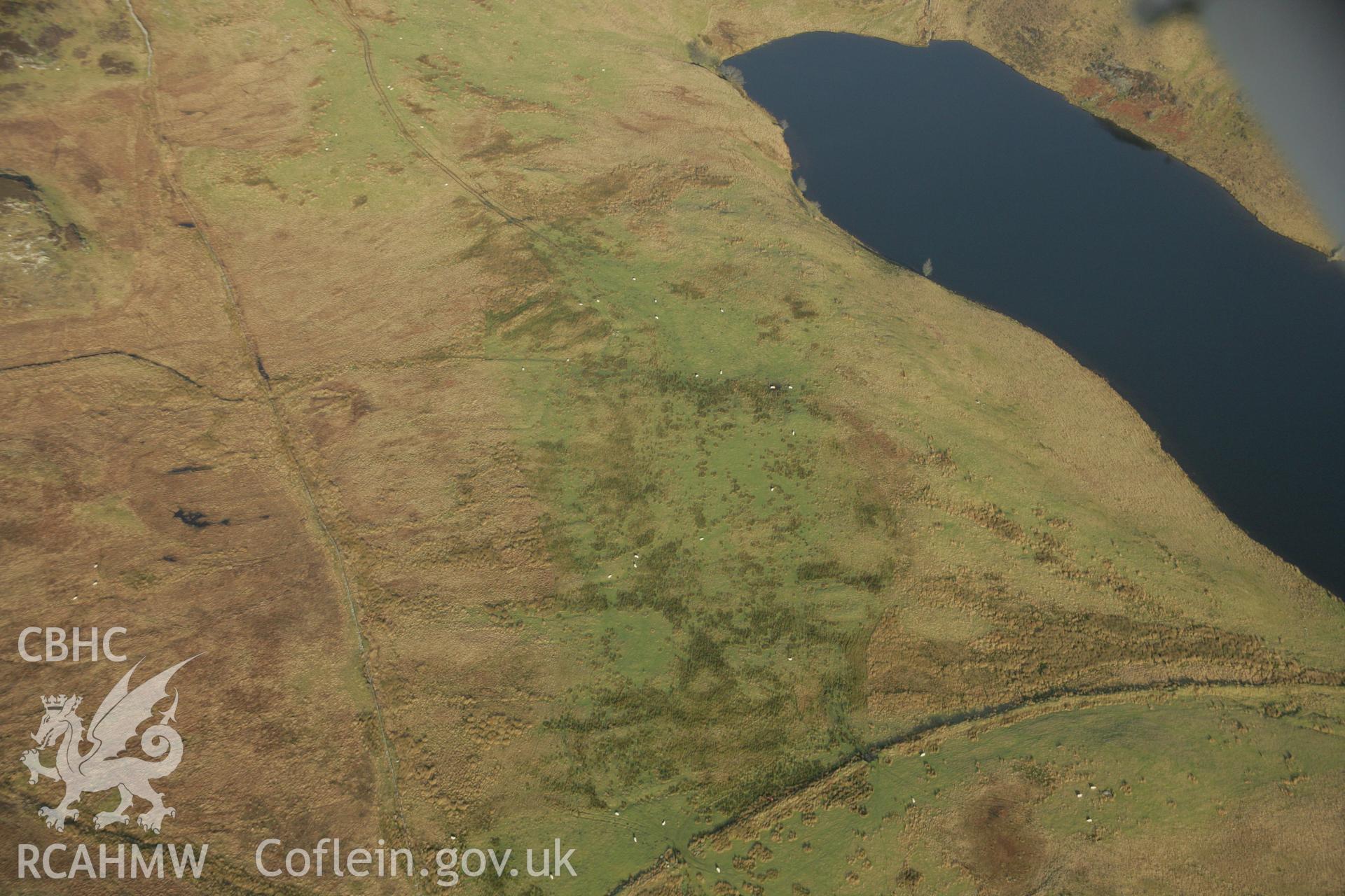 RCAHMW colour oblique aerial photograph of Llyn Hiraethlyn I and Roman practice camp. Taken on 25 January 2007 by Toby Driver