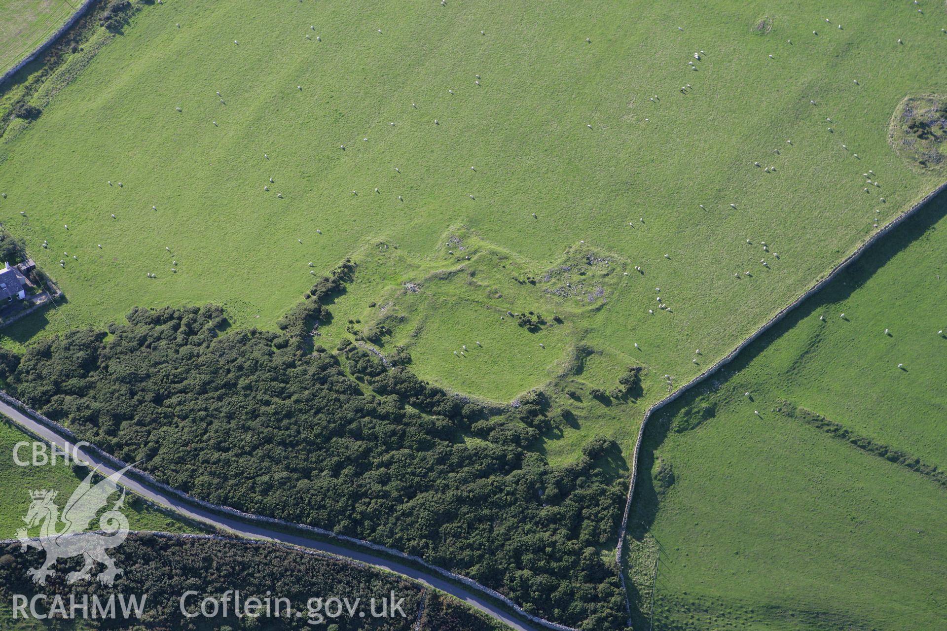 RCAHMW colour oblique aerial photograph of Rhiw Defended Enclosure. Taken on 06 September 2007 by Toby Driver