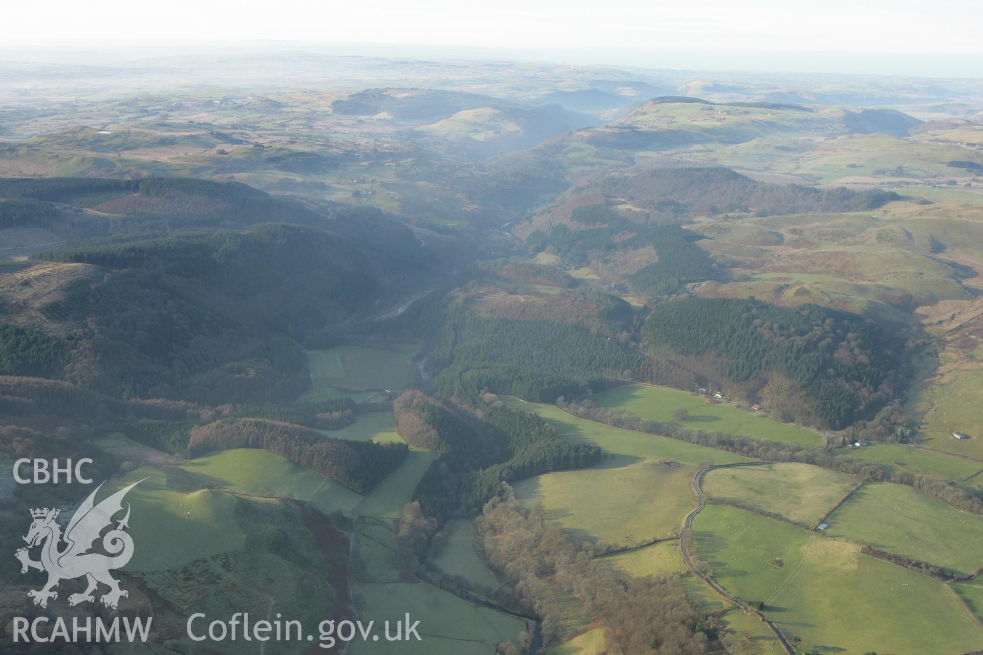 RCAHMW colour oblique photograph of Pont Dologau and landscape looking westwards. Taken by Toby Driver on 20/12/2007.
