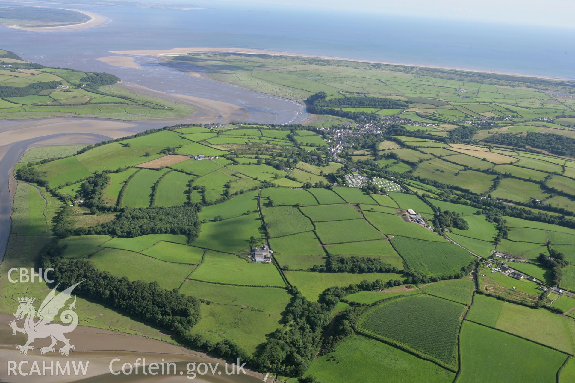 RCAHMW colour oblique aerial photograph of Laugharne Castle, viewed from the north. Taken on 30 July 2007 by Toby Driver