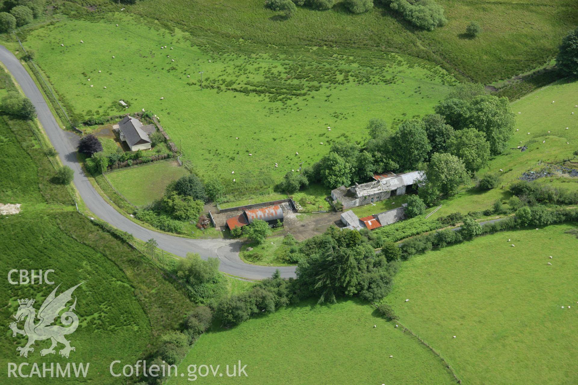 RCAHMW colour oblique aerial photograph of Spite Inn, showing the building prior to demolition. Taken on 09 July 2007 by Toby Driver