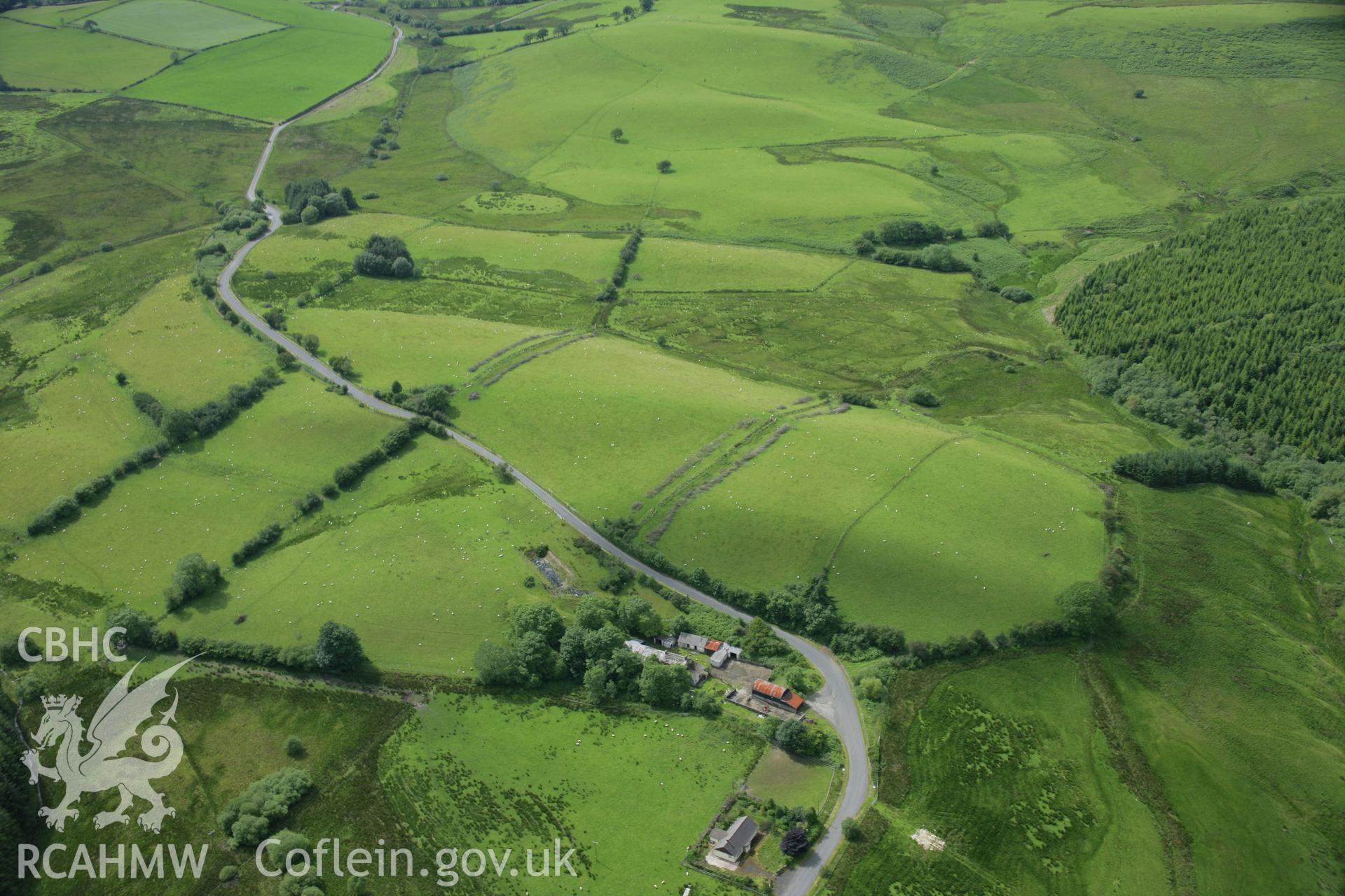 RCAHMW colour oblique aerial photograph of Spite Inn, showing the building prior to demolition. Taken on 09 July 2007 by Toby Driver