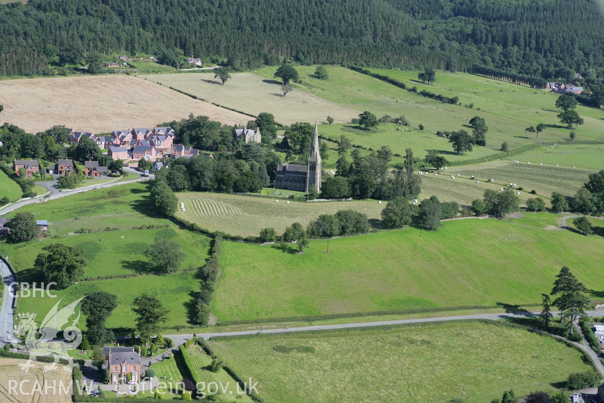 RCAHMW colour oblique aerial photograph of Holy Trinity Church, Leighton. Taken on 31 July 2007 by Toby Driver