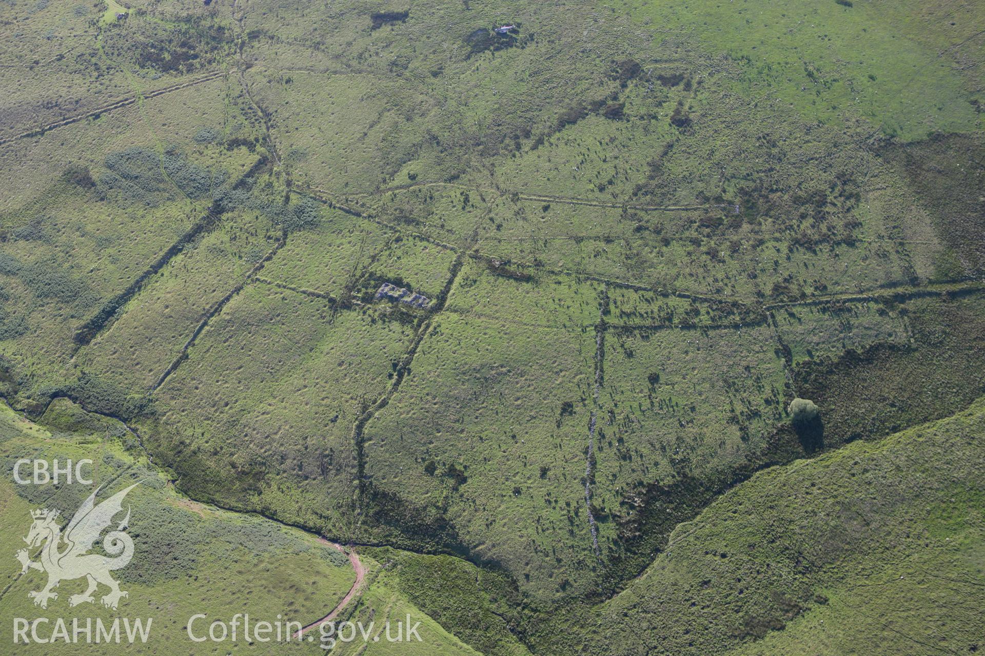 RCAHMW colour oblique aerial photograph of Glan-y-Rhyd Farmstead and surrounding landscape. Taken on 08 August 2007 by Toby Driver
