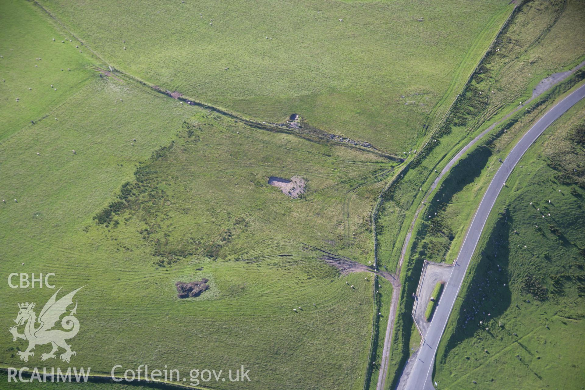 RCAHMW colour oblique aerial photograph of Blaen Clydach Fach Cairns I and II. Taken on 08 August 2007 by Toby Driver