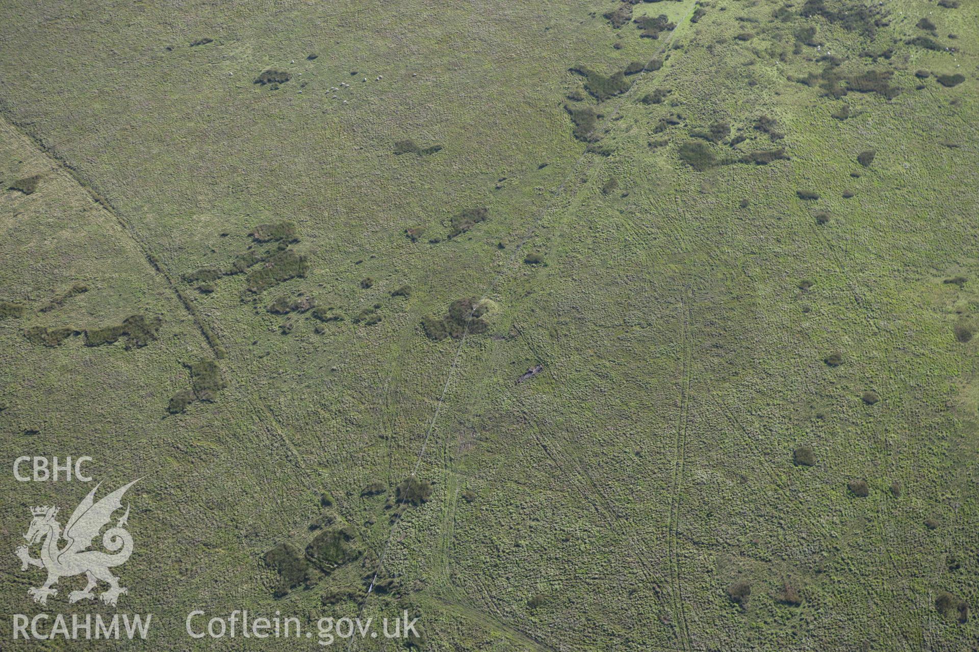 RCAHMW colour oblique aerial photograph of Crug Barrow, Llanfihangel Nant Bran. Taken on 08 August 2007 by Toby Driver