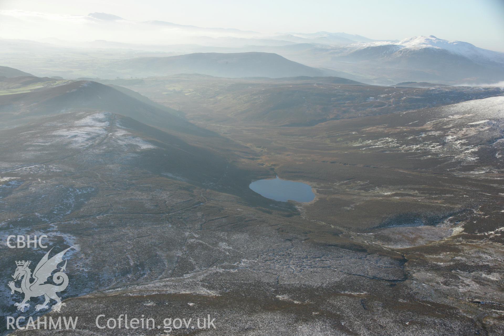RCAHMW colour oblique aerial photograph of Carnedd-y-Filiast and landscape view of Llyn Hesgyn. Taken on 25 January 2007 by Toby Driver