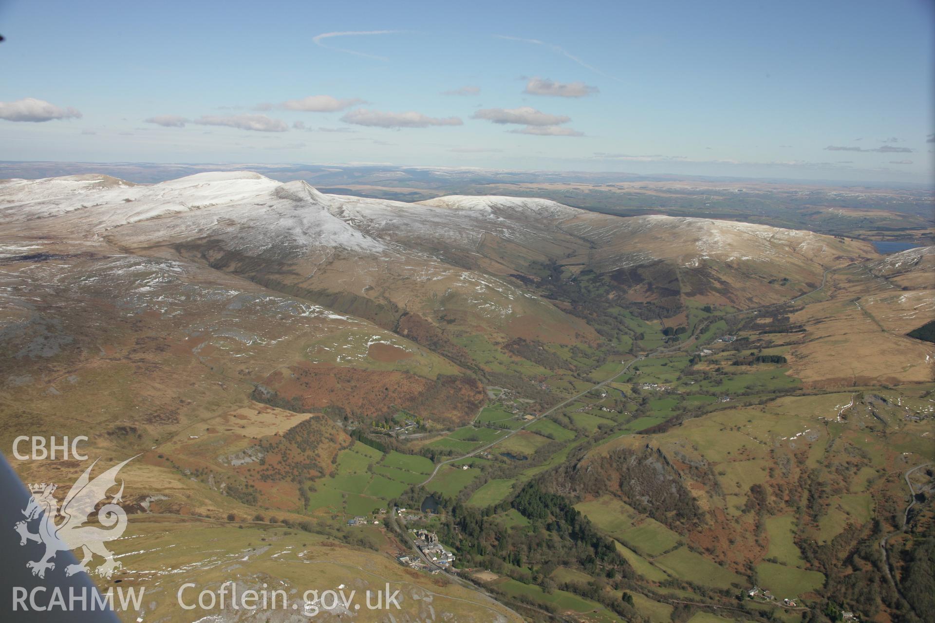 RCAHMW colour oblique aerial photograph of Ogof-Yr-Esgyrn (Bone Cave), Dan-Yr-Ogof, in landscape view looking north. Taken on 21 March 2007 by Toby Driver