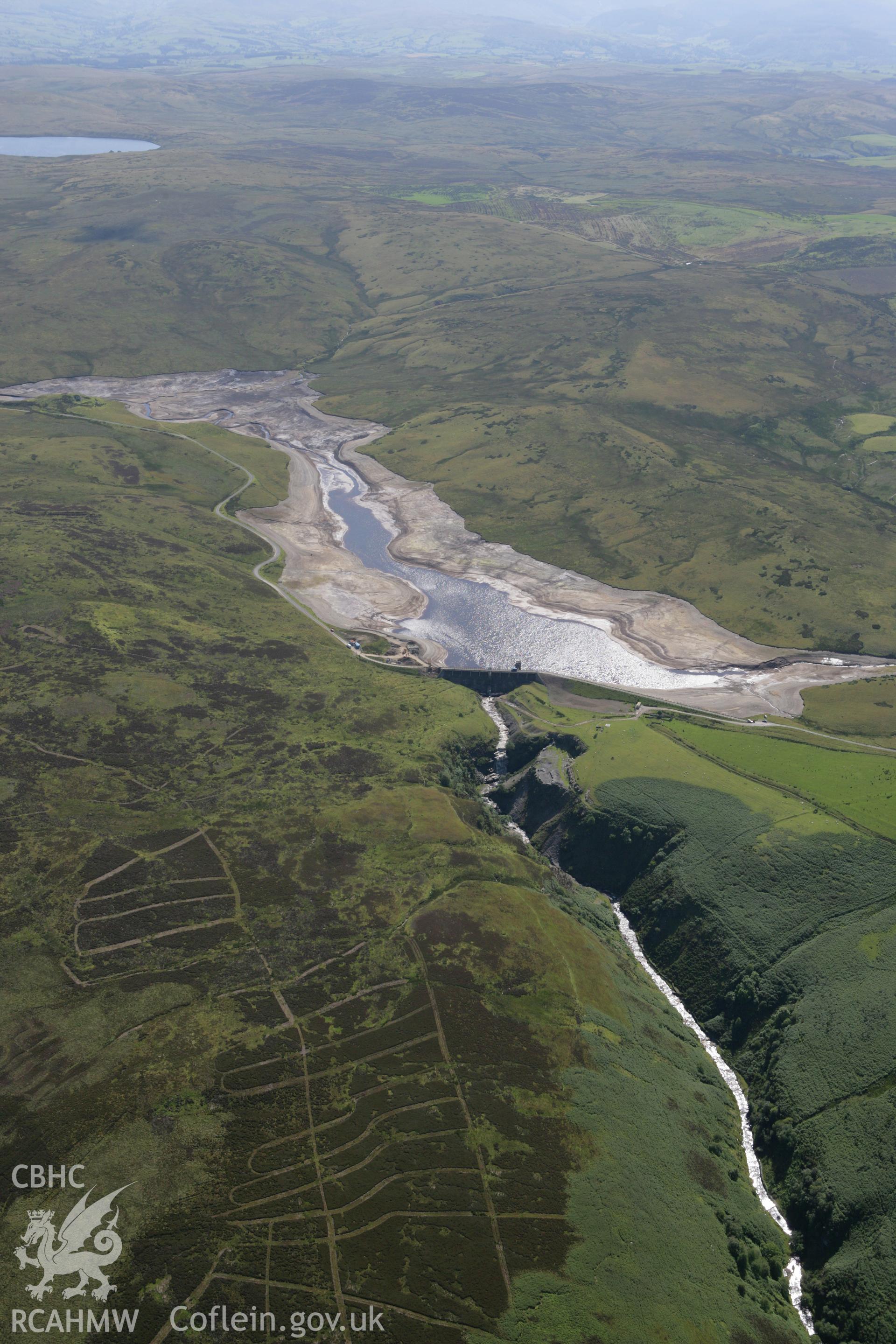 RCAHMW colour oblique aerial photograph showing landscape of Llyn Aled Isaf Mesolithic Occupation Site. Taken on 31 July 2007 by Toby Driver