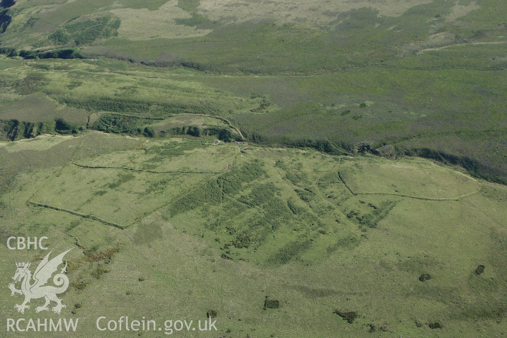 RCAHMW colour oblique aerial photograph of Pwll Cam West. Taken on 08 August 2007 by Toby Driver