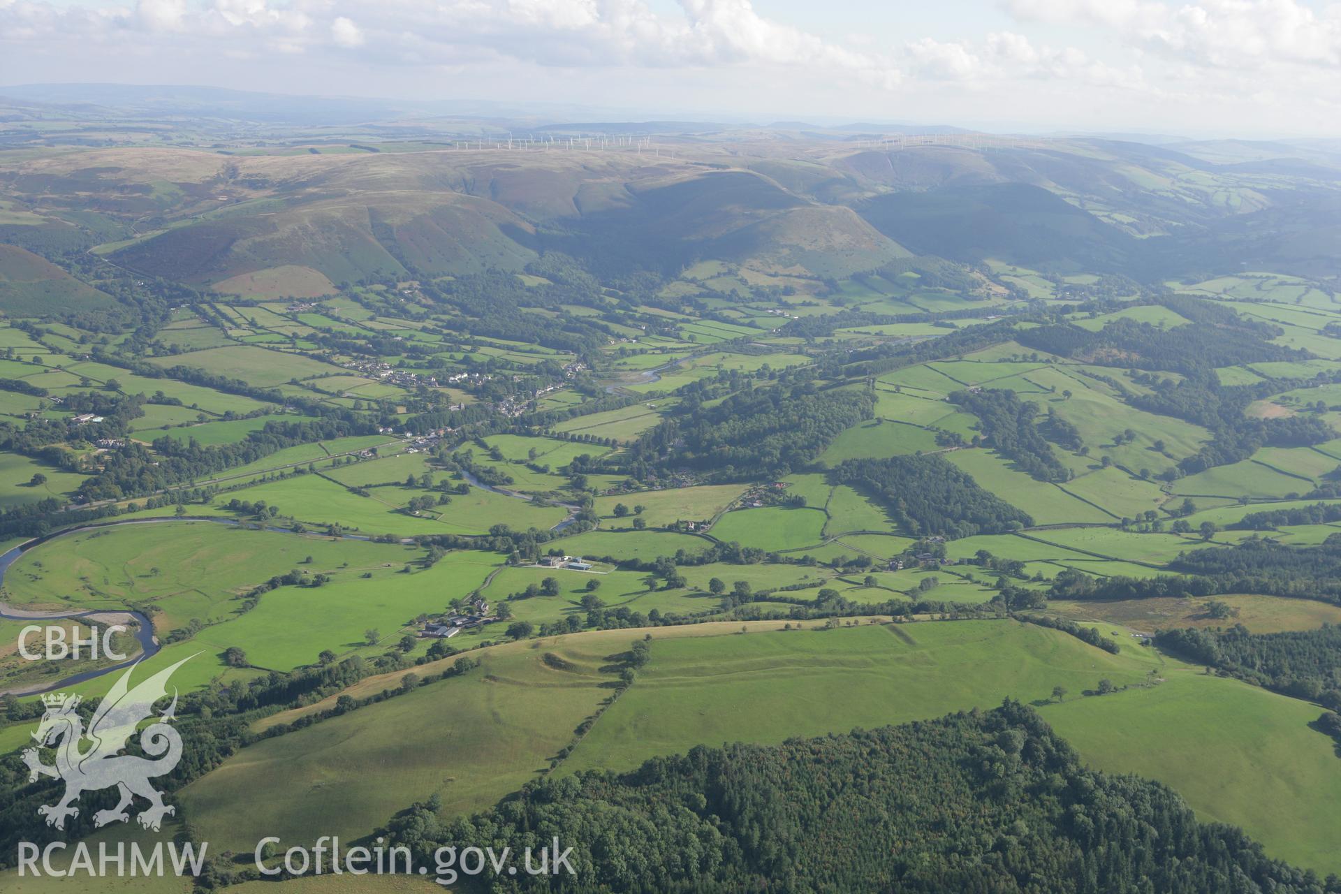 RCAHMW colour oblique aerial photograph of Cefn Carnedd Hillfort, near Caersws, from the north. Taken on 06 September 2007 by Toby Driver