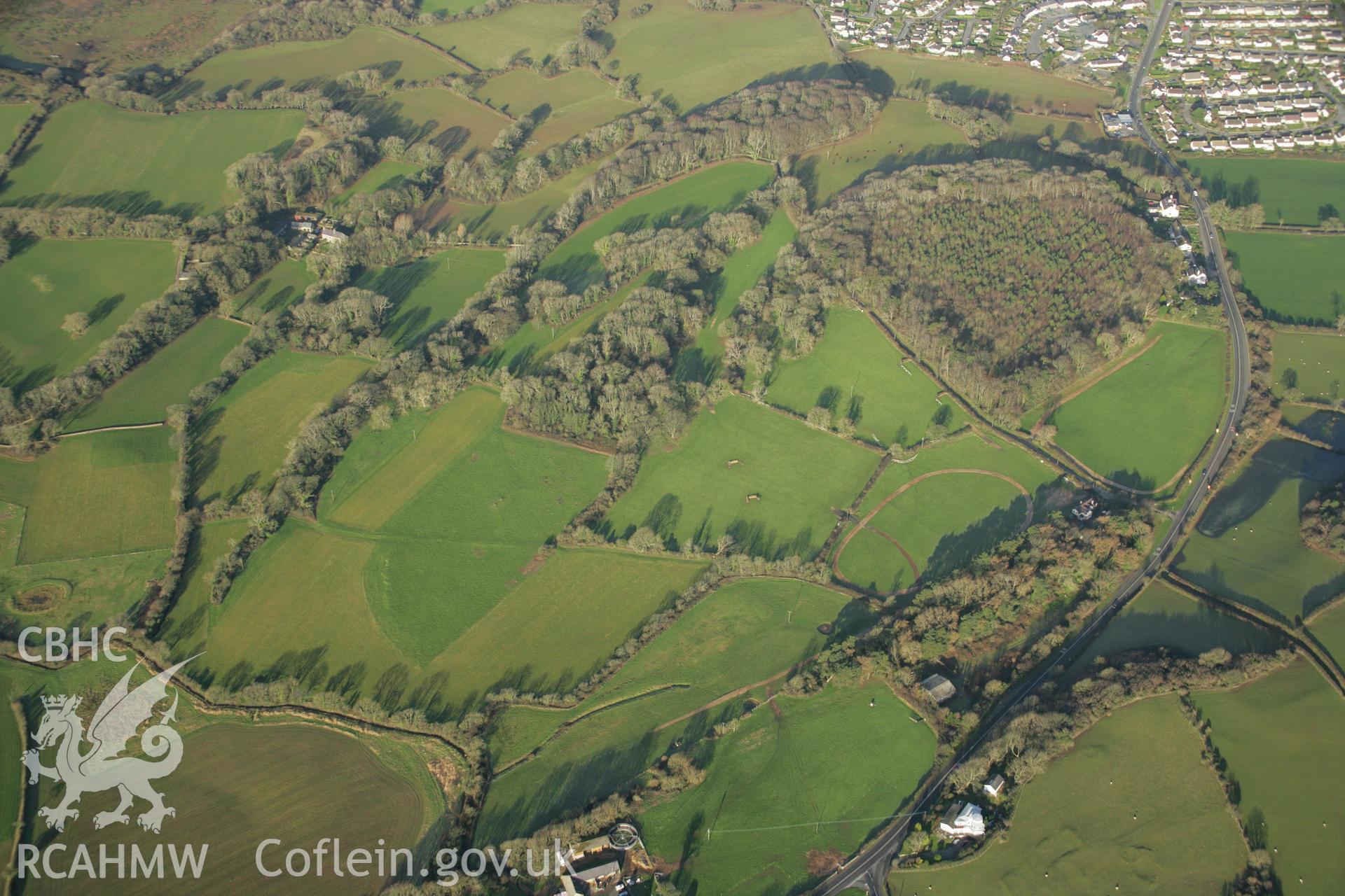 RCAHMW colour oblique aerial photograph of the Viking settlement at Glyn, Llanbedrgoch, and the surrounding landscape. Taken on 25 January 2007 by Toby Driver