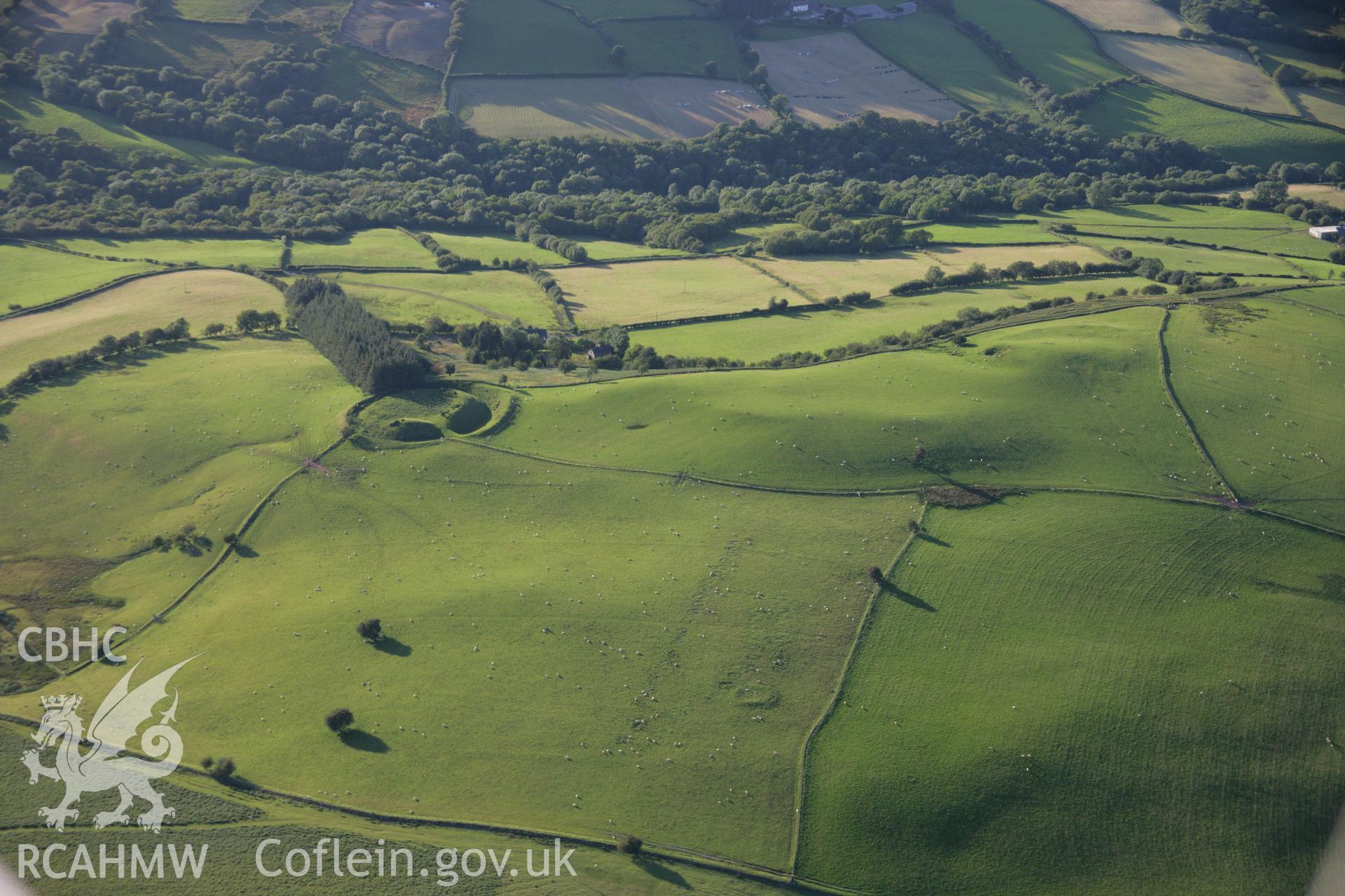 RCAHMW colour oblique aerial photograph of Waun Gynllwch (Coed Caeau) Defended Enclosure. Taken on 08 August 2007 by Toby Driver