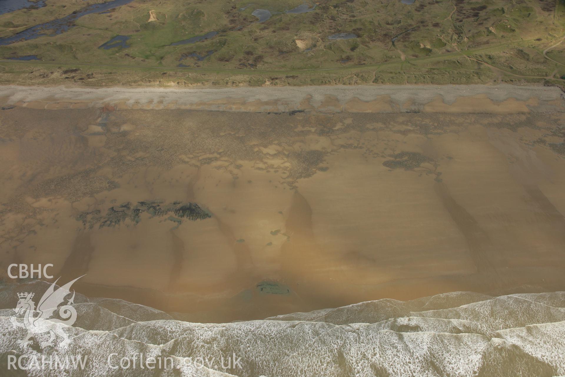 RCAHMW colour oblique aerial photograph of Gwely'r Misgl Wreck on Kenfig Sands. Taken on 16 March 2007 by Toby Driver