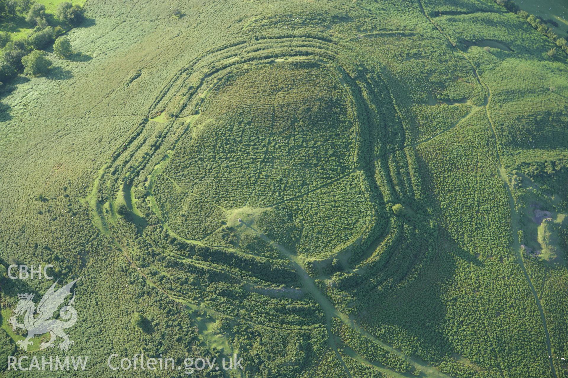 RCAHMW colour oblique aerial photograph of Pen-y-Crug Hillfort. Taken on 08 August 2007 by Toby Driver