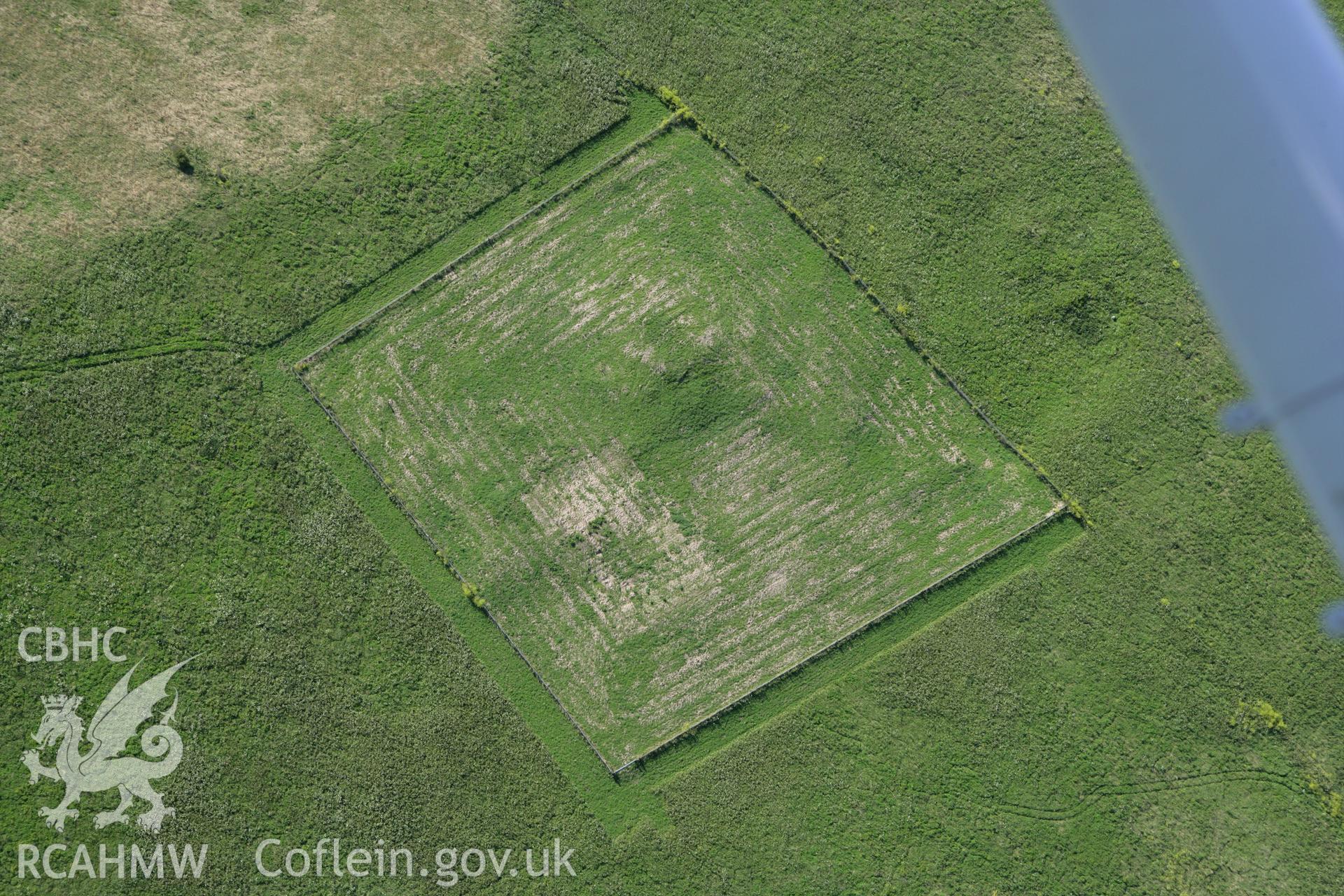 RCAHMW colour oblique aerial photograph of Brownslade Round Barrow, Castlemartin. Taken on 30 July 2007 by Toby Driver