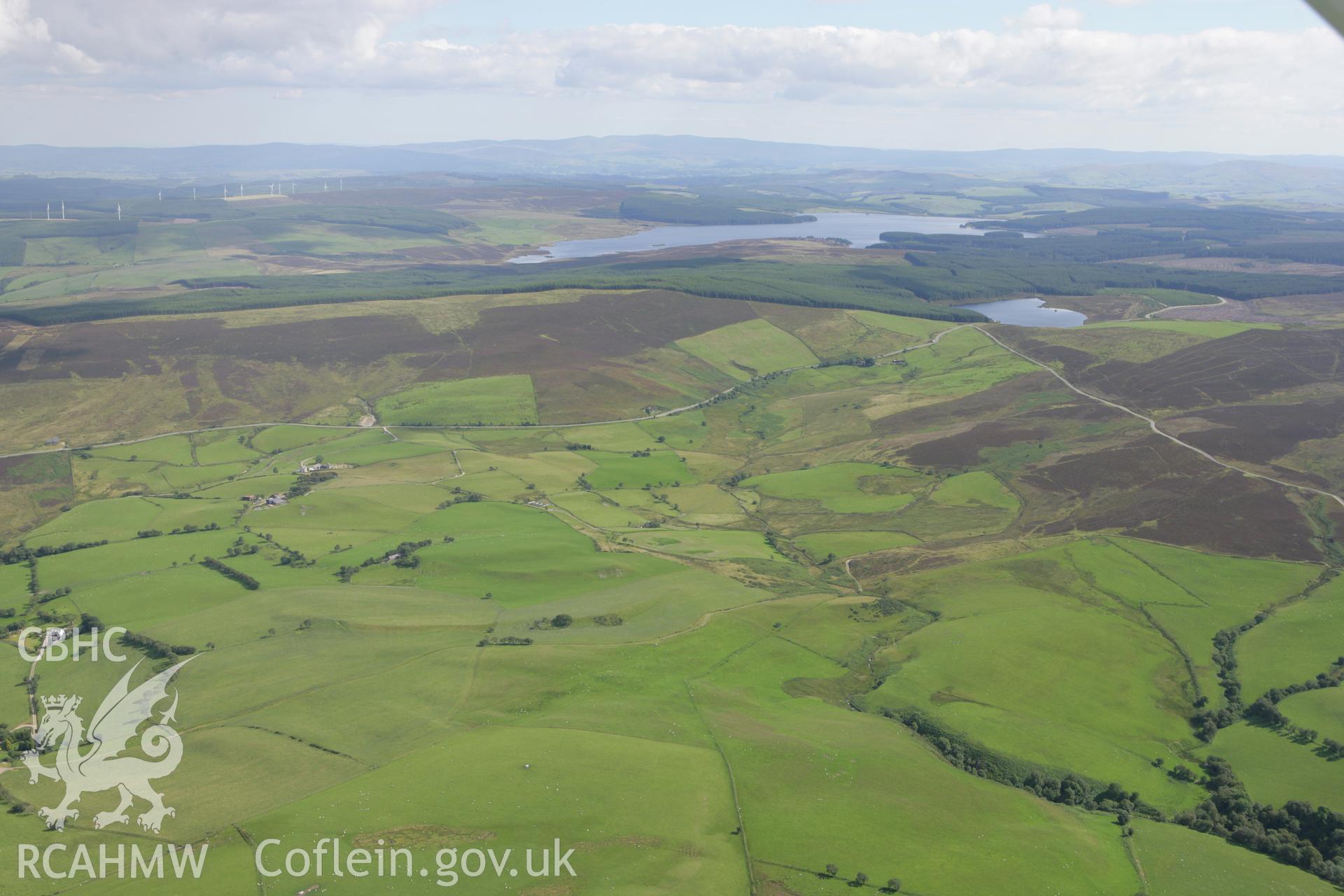 RCAHMW colour oblique aerial photograph showing landscape of Llyn Brenig, Mynydd Hiraethog, viewed from the north-west. Taken on 31 July 2007 by Toby Driver