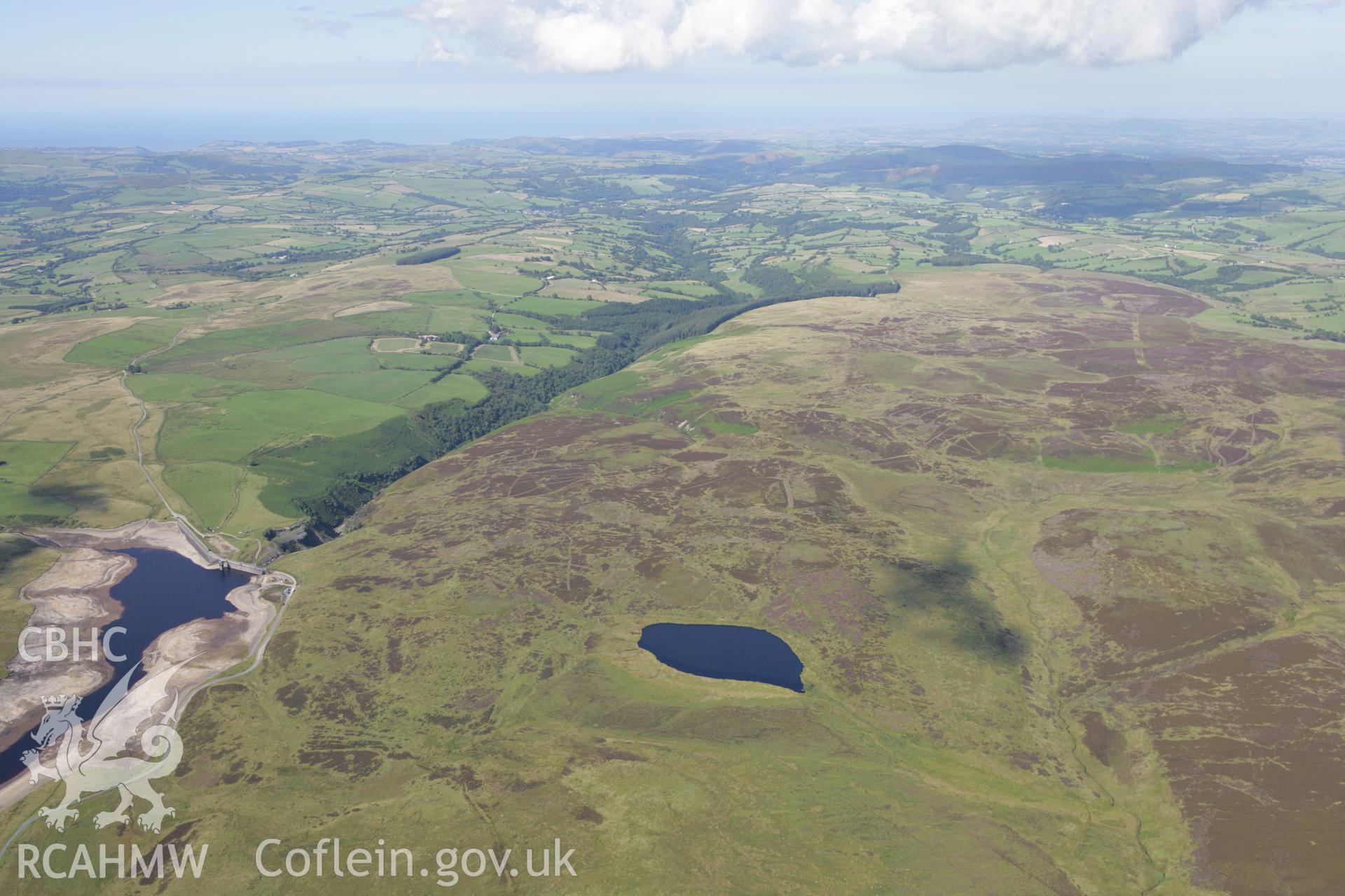 RCAHMW colour oblique aerial photograph showinglandscape of Llyn Aled Isaf Mesolithic Occupation Site. Taken on 31 July 2007 by Toby Driver