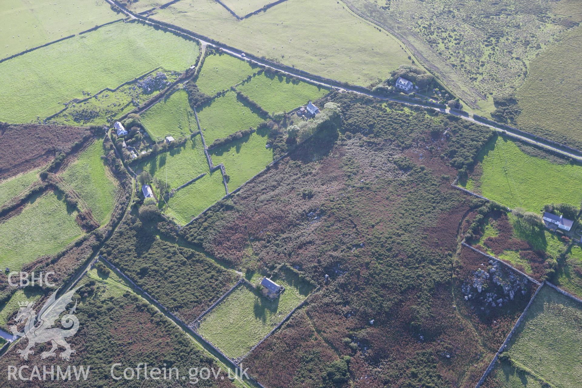 RCAHMW colour oblique aerial photograph of Rhiw Burial Chambers. Taken on 06 September 2007 by Toby Driver