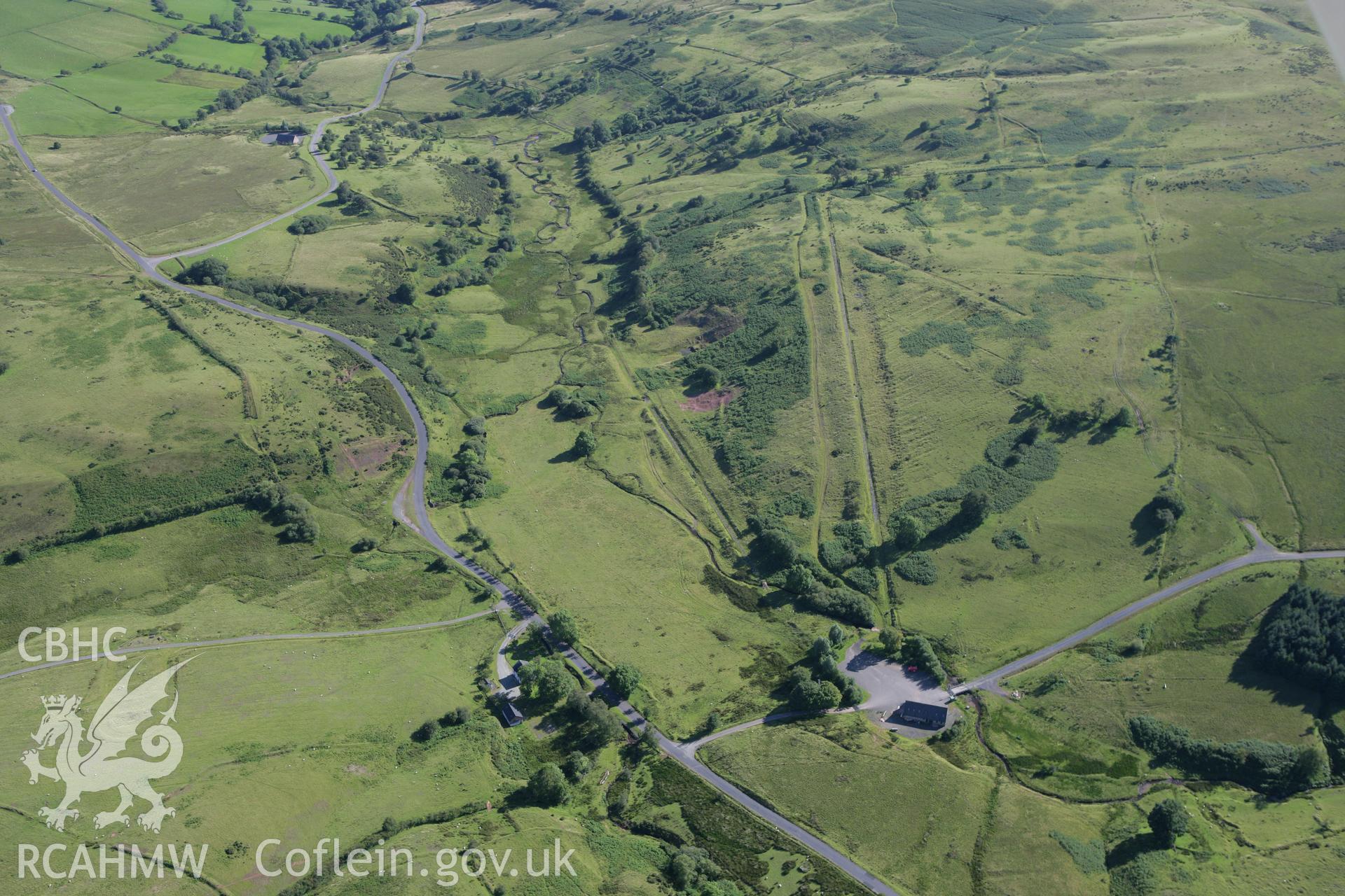 RCAHMW colour oblique aerial photograph of Disgwylfa Farmstead with redundant track targets. Taken on 08 August 2007 by Toby Driver