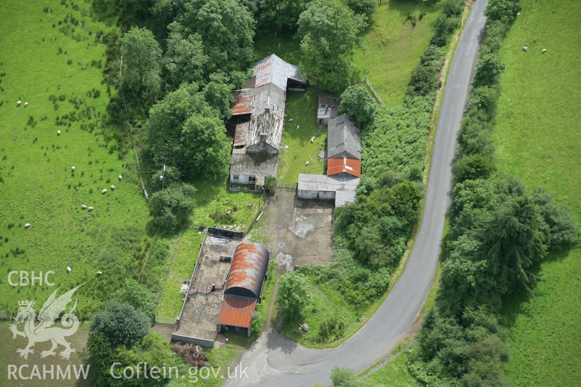 RCAHMW colour oblique aerial photograph of Spite Inn, showing the building prior to demolition. Taken on 09 July 2007 by Toby Driver