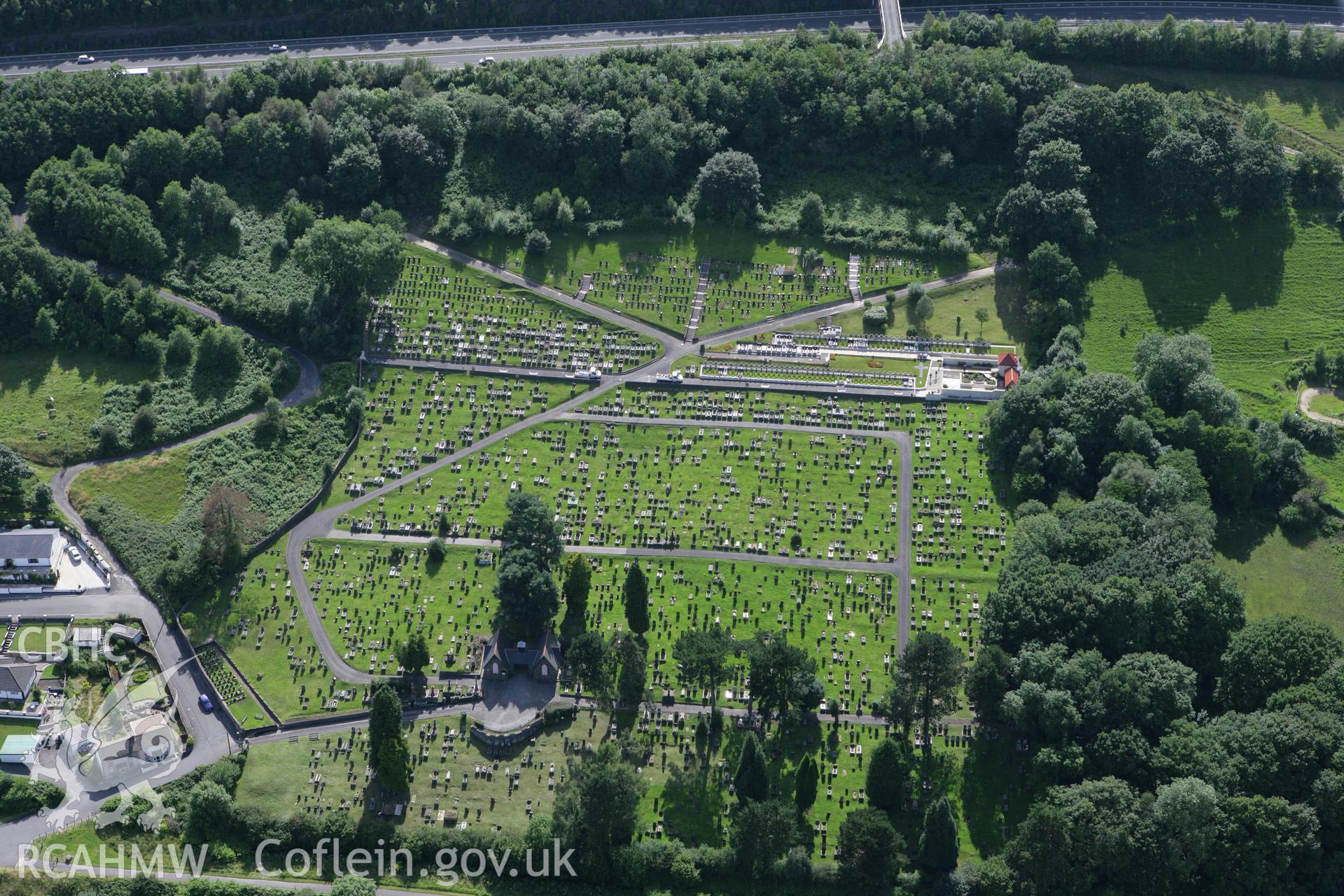 RCAHMW colour oblique aerial photograph of Aberfan Cemetery viewed from the east. Taken on 30 July 2007 by Toby Driver