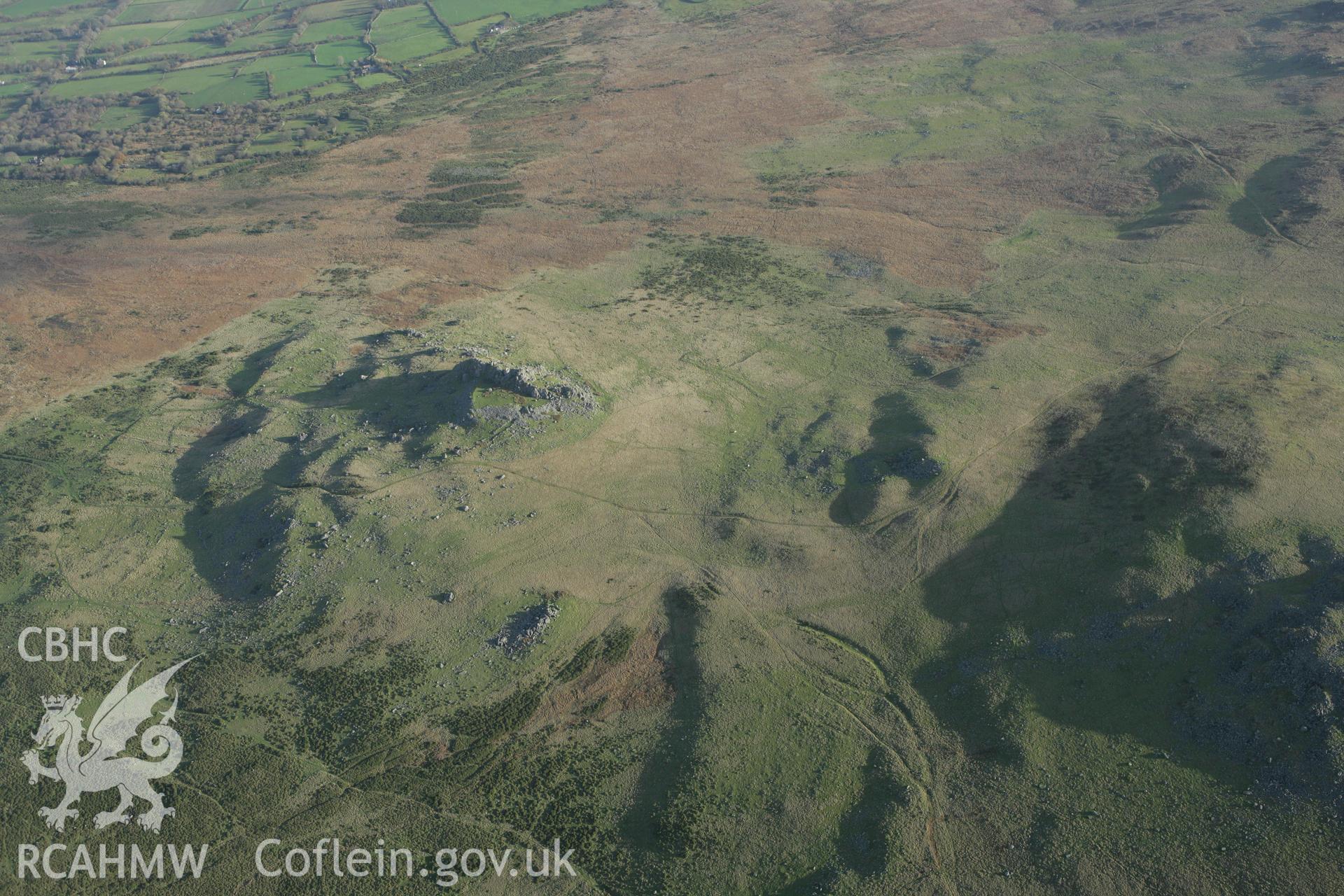 RCAHMW colour oblique photograph of Carn Alw hillfort, and landscape. Taken by Toby Driver on 29/11/2007.