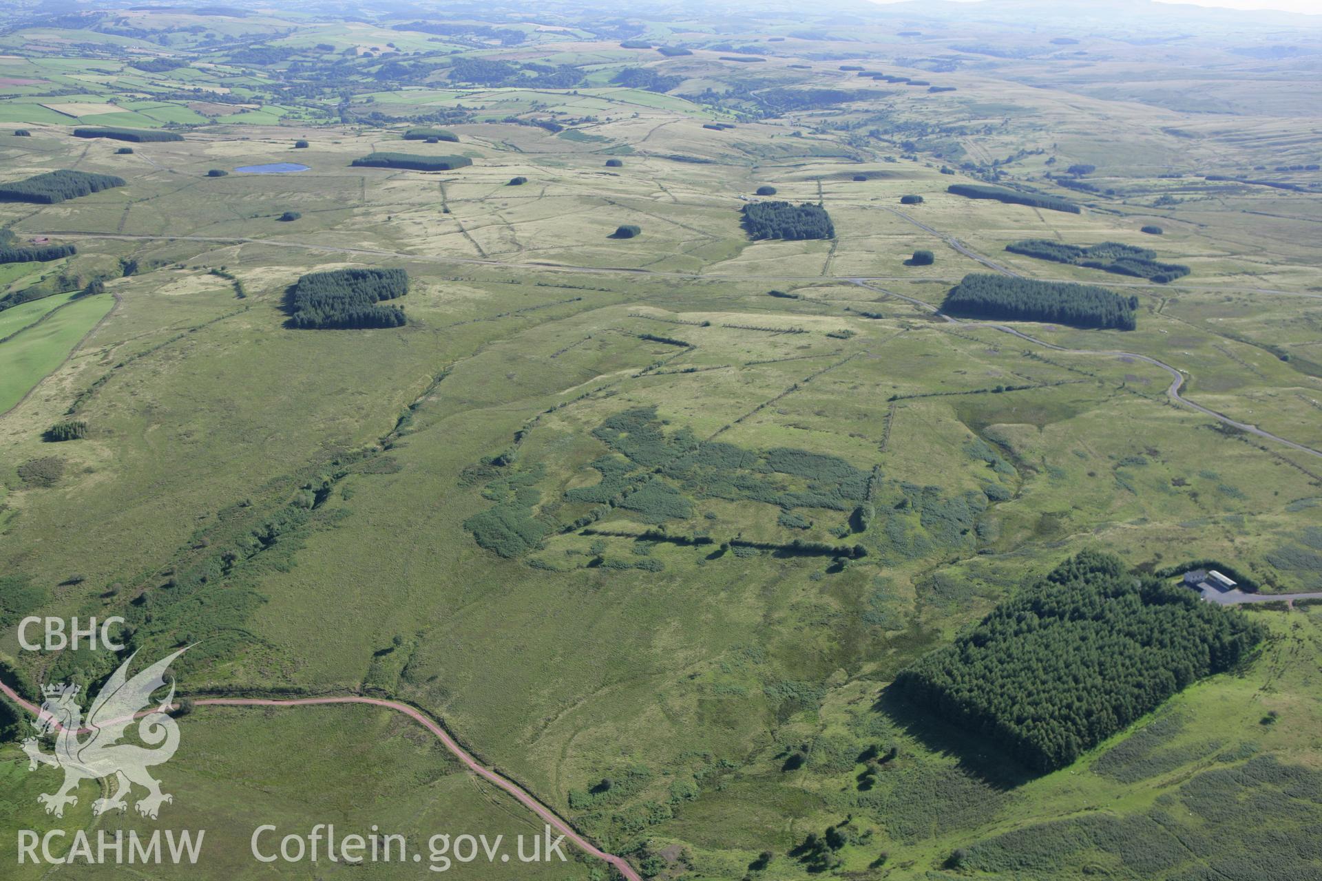 RCAHMW colour oblique aerial photograph of Sennybridge Military Training Area, Mynydd Epynt, looking south and showing the Cefn Corast landscape. Taken on 08 August 2007 by Toby Driver