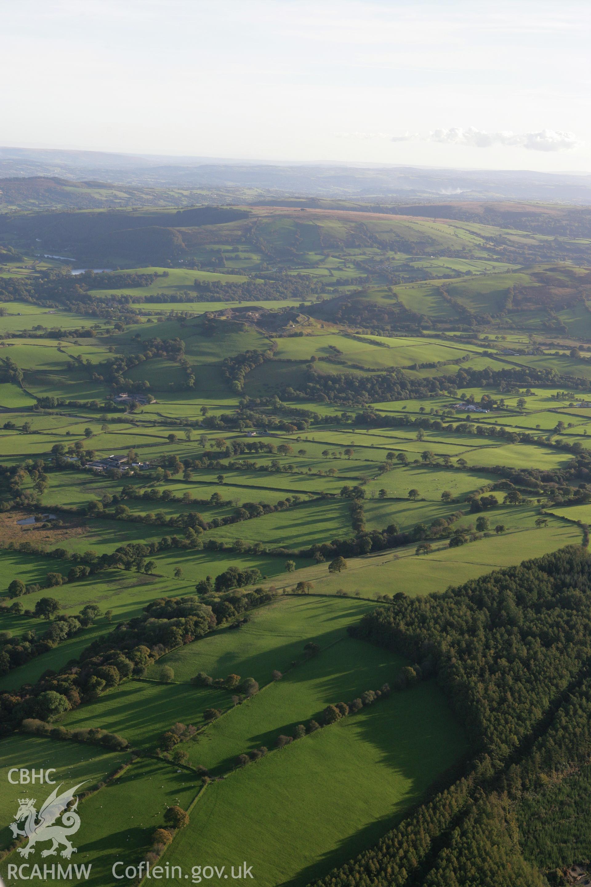 RCAHMW colour oblique photograph of Landscape south to Pen y Ddinas, lost hillfort. Taken by Toby Driver on 04/10/2007.