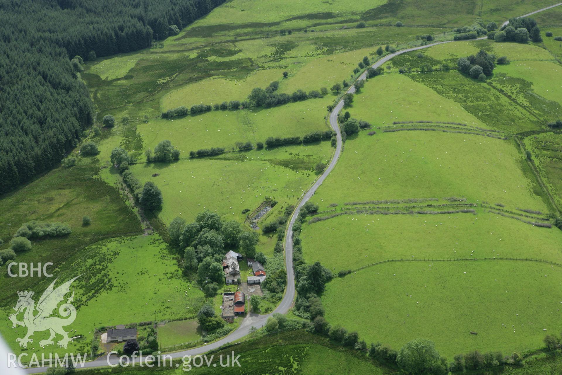 RCAHMW colour oblique aerial photograph of Spite Inn, showing the building prior to demolition. Taken on 09 July 2007 by Toby Driver