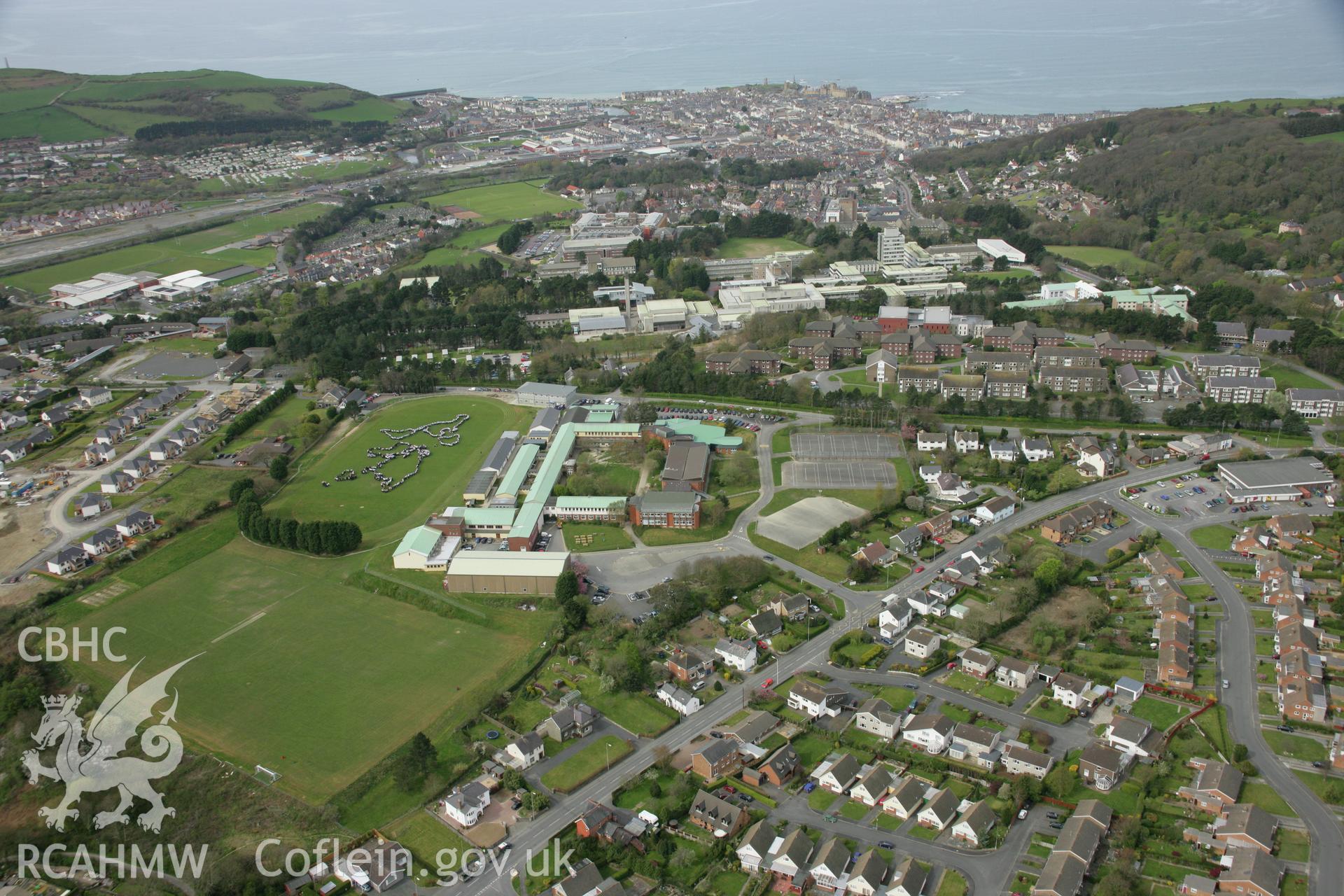 RCAHMW colour oblique aerial photograph of Penglais Comprehensive School, World Map of 1500 pupils. Taken on 17 April 2007 by Toby Driver