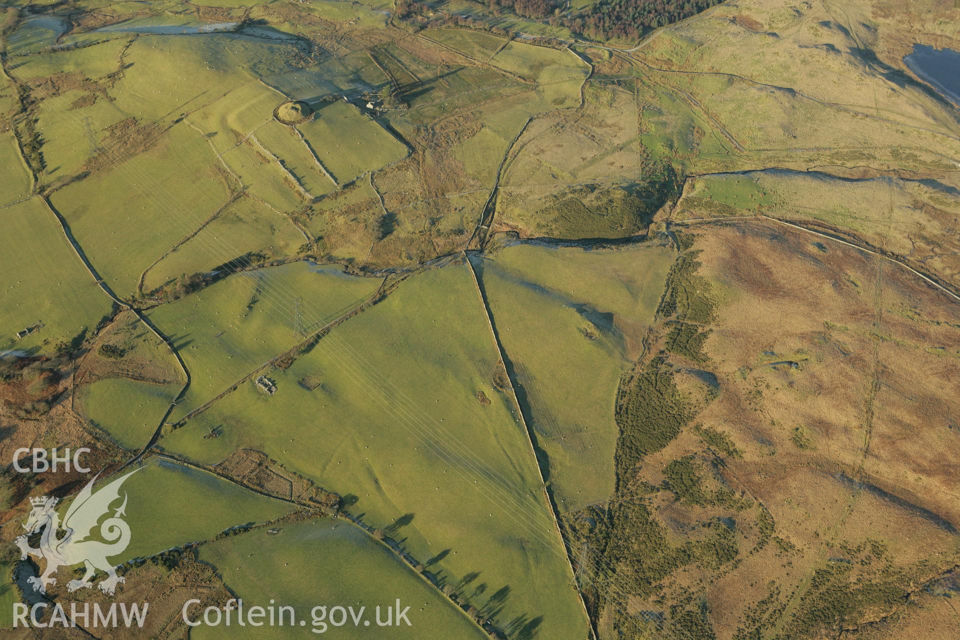 RCAHMW colour oblique photograph of Tomen y Mur Roman military settlement. Taken by Toby Driver on 20/12/2007.