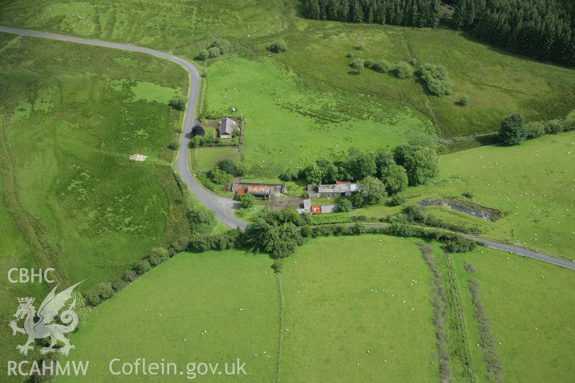 RCAHMW colour oblique aerial photograph of Spite Inn, showing the building prior to demolition. Taken on 09 July 2007 by Toby Driver