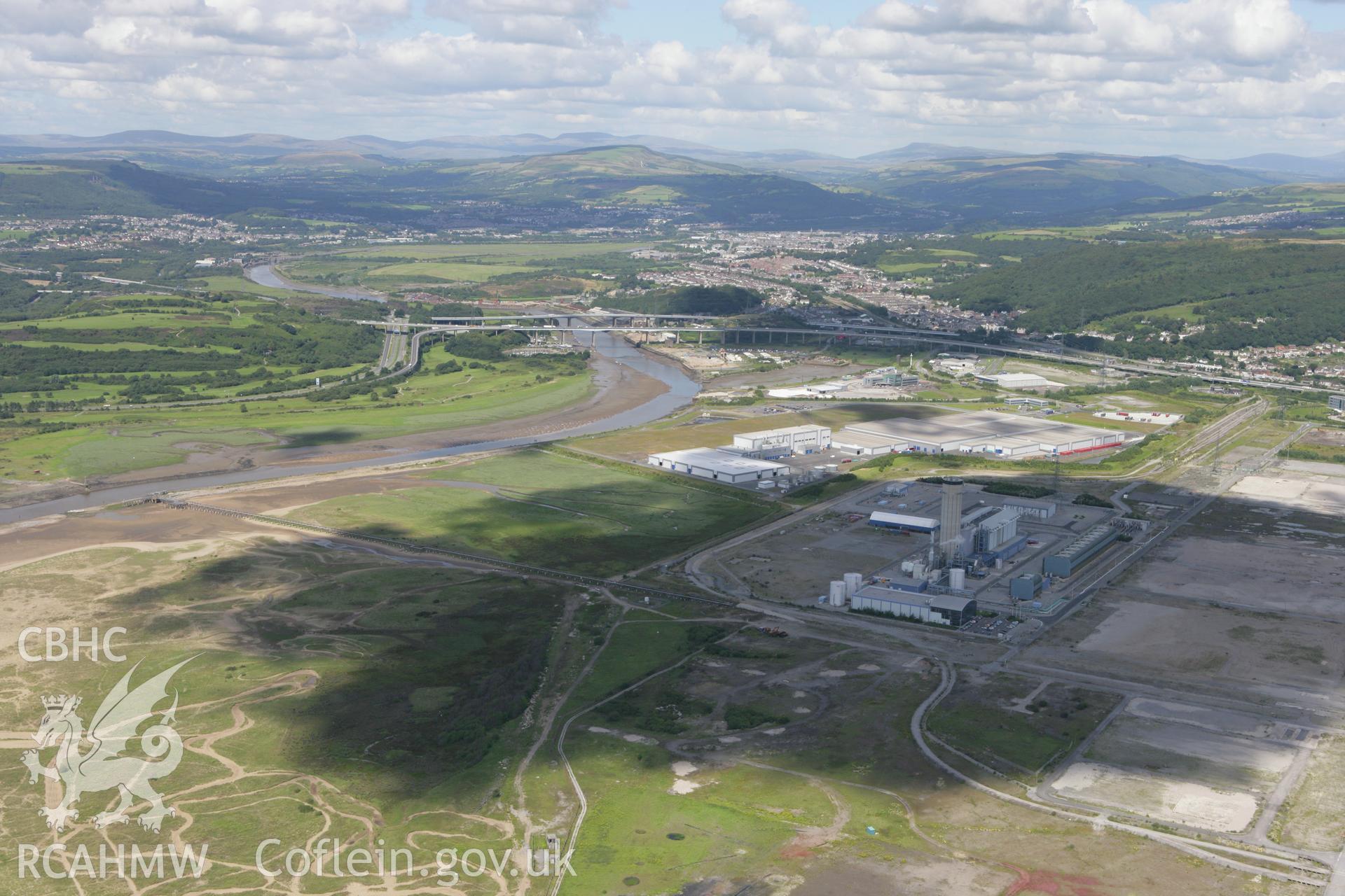 RCAHMW colour oblique aerial photograph of BP Chemicals, Baglan Bay, Baglan, viewed from the south. Taken on 30 July 2007 by Toby Driver