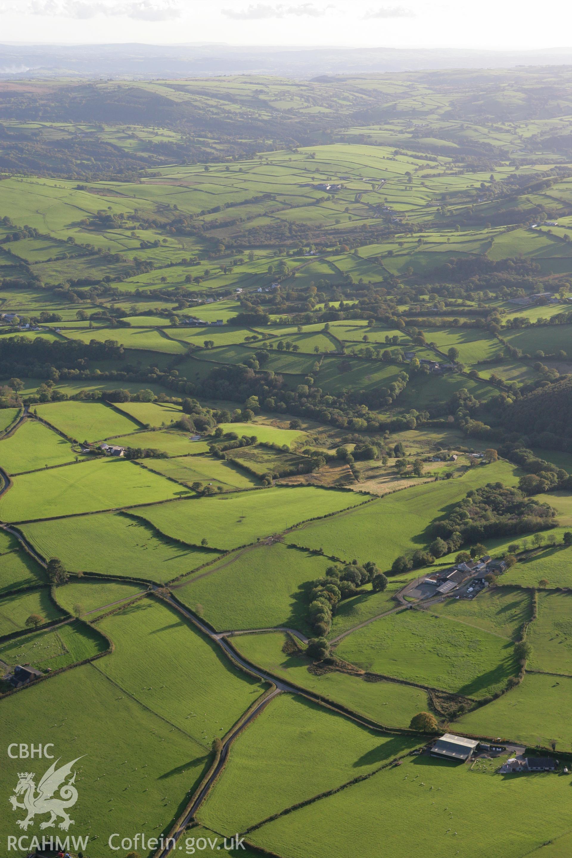 RCAHMW colour oblique photograph of Landscape south over Llansawel village. Taken by Toby Driver on 04/10/2007.