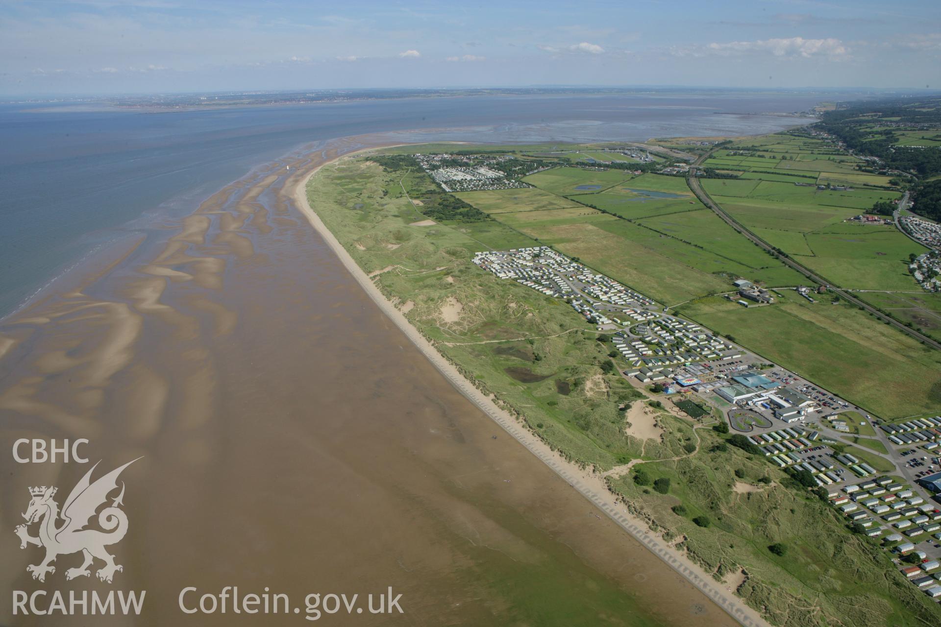 RCAHMW colour oblique aerial photograph of Point of Ayr Lighthouse. A landscape view from the west. Taken on 31 July 2007 by Toby Driver