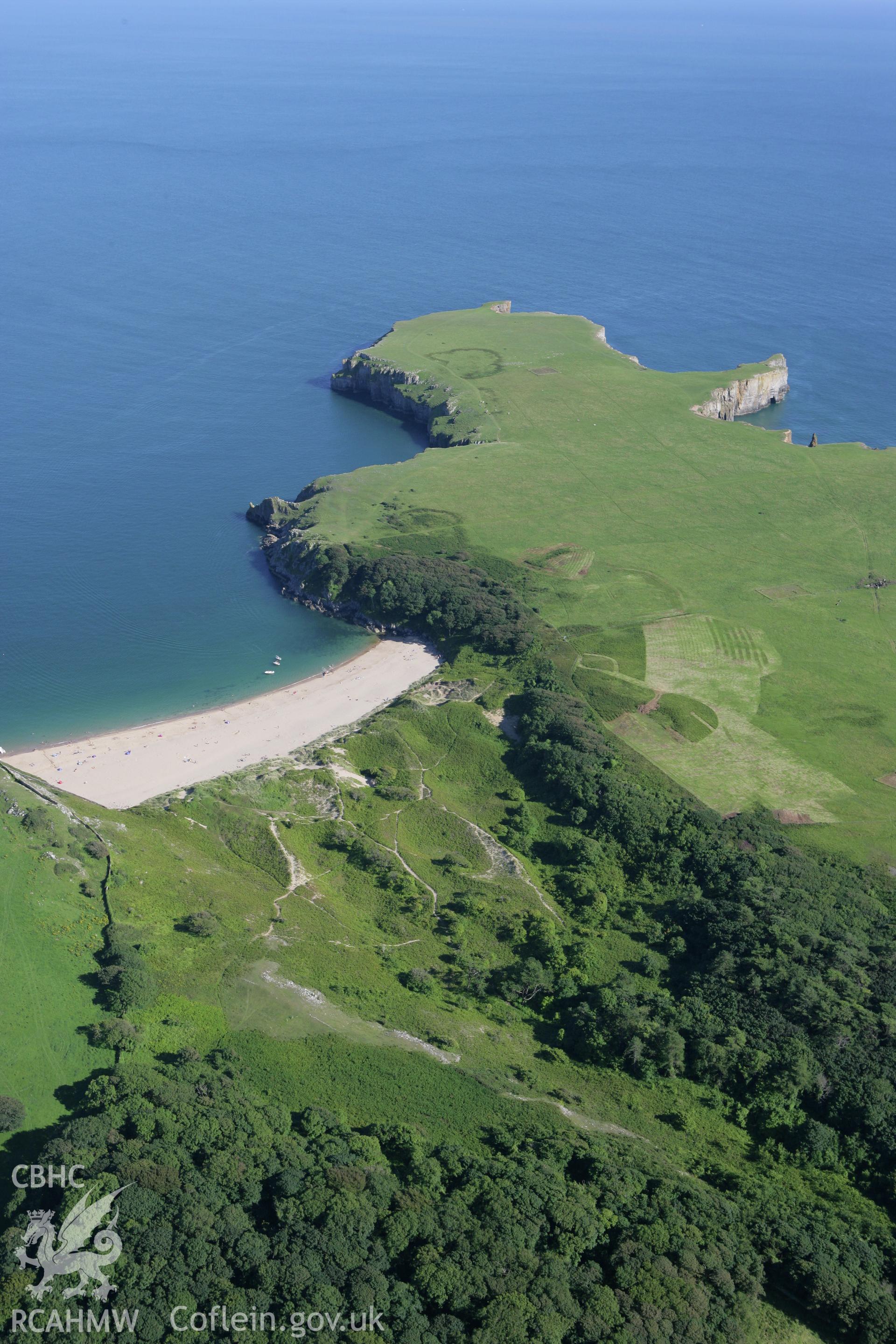 RCAHMW colour oblique aerial photograph of Mowingword Promontory Enclosure, on Stackpole Head, viewed from the north-west. Taken on 30 July 2007 by Toby Driver