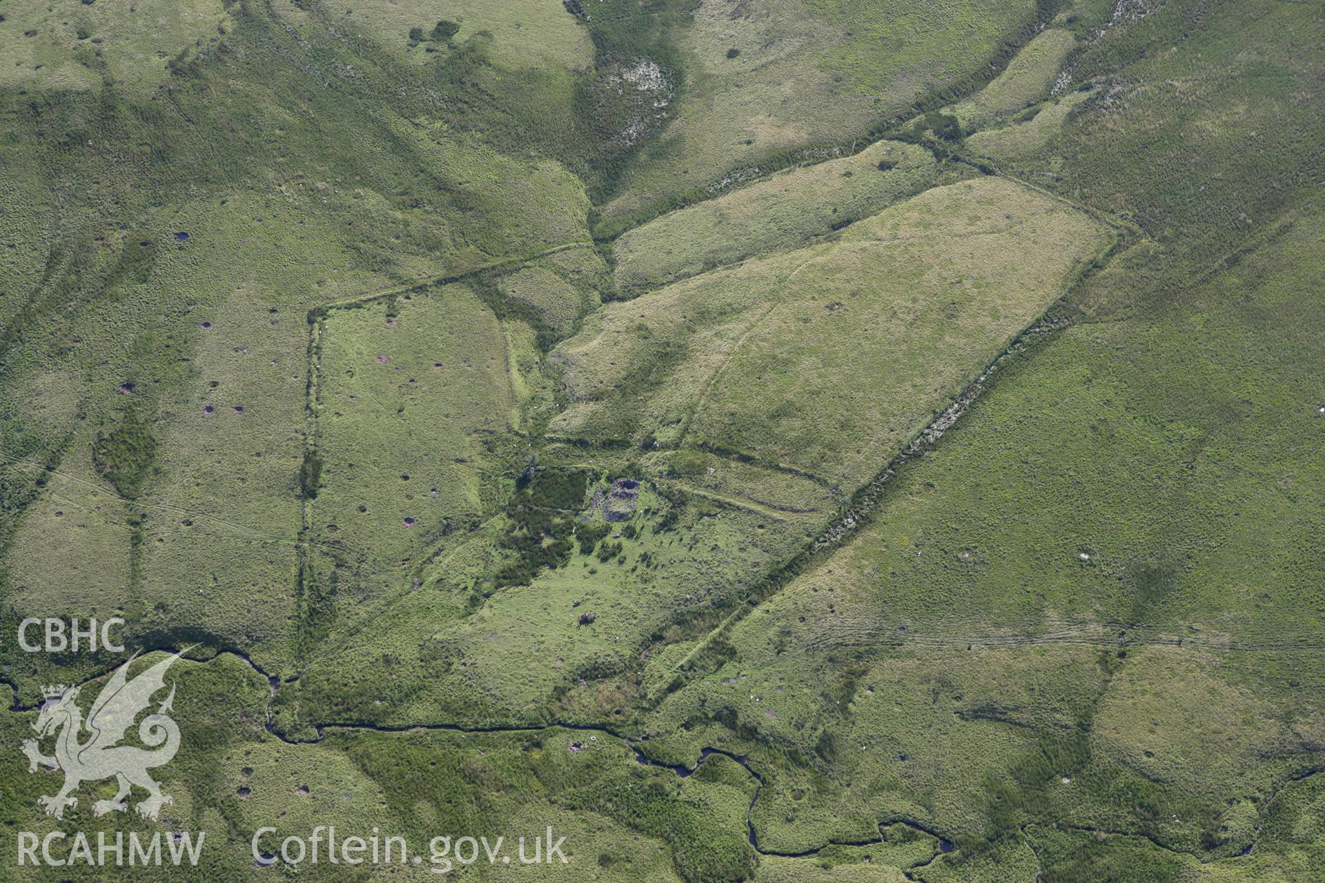 RCAHMW colour oblique aerial photograph of the farmstead at Ysgir Fechan. Taken on 08 August 2007 by Toby Driver