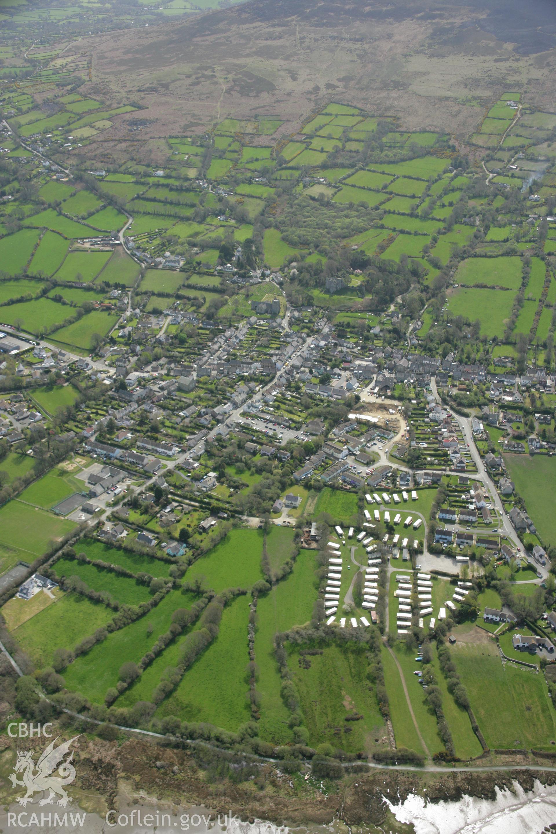 RCAHMW colour oblique aerial photograph showing view of town of Newport, Pembrokeshire. Taken on 17 April 2007 by Toby Driver