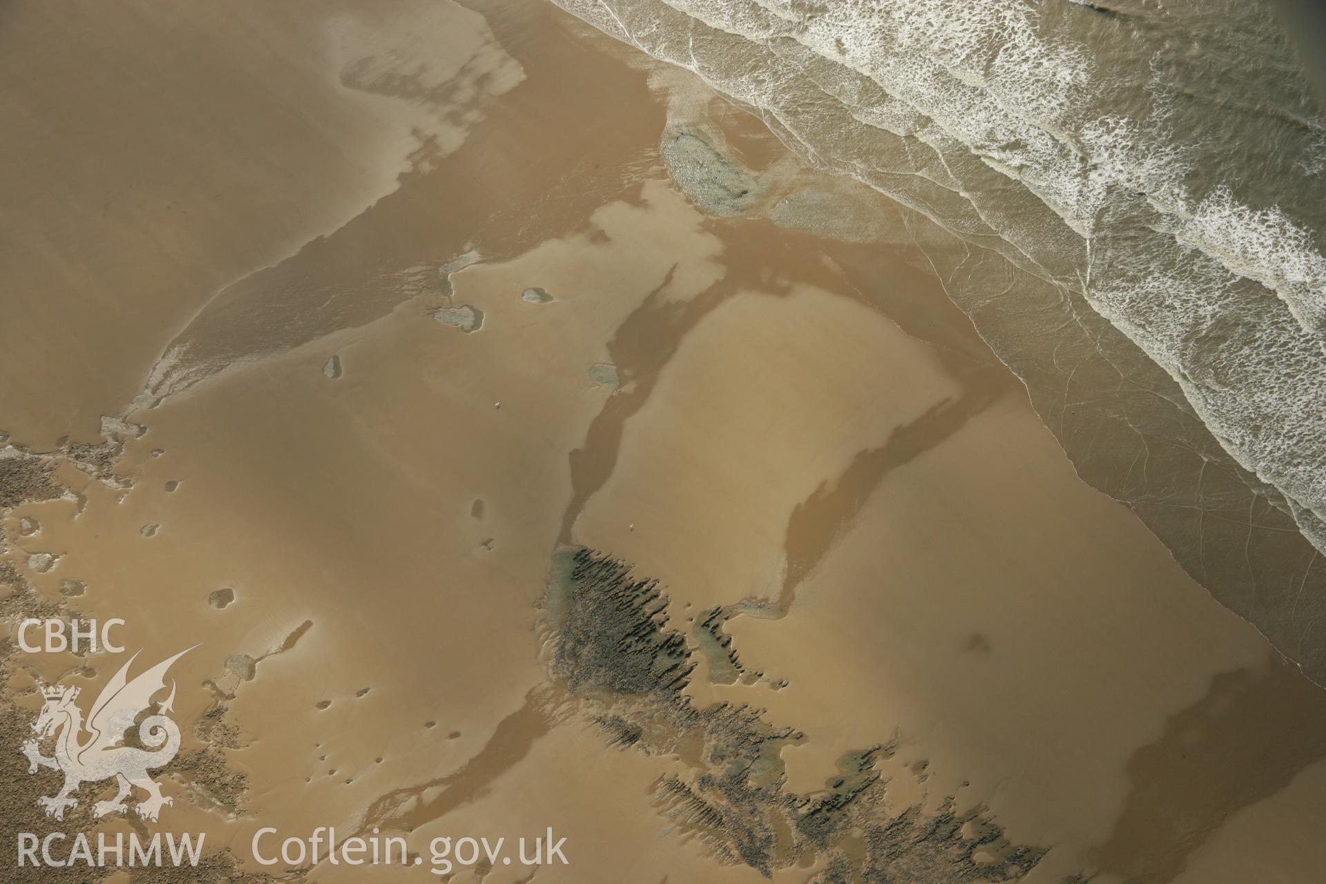 RCAHMW colour oblique aerial photograph of Gwely'r Misgl Wreck on Kenfig Sands. Taken on 16 March 2007 by Toby Driver