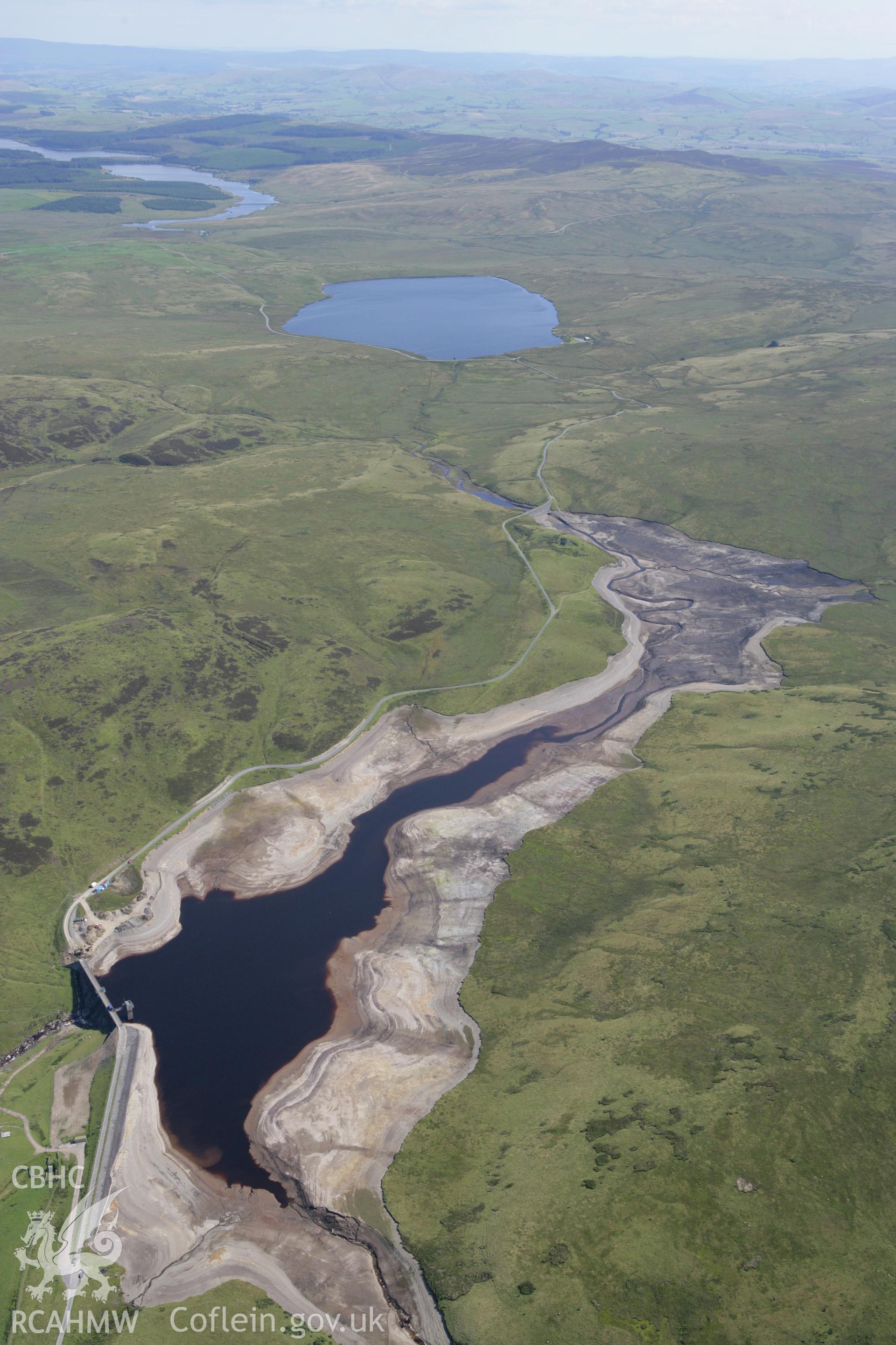 RCAHMW colour oblique aerial photograph showing landscape of Llyn Aled Isaf Mesolithic Occupation Site. Taken on 31 July 2007 by Toby Driver