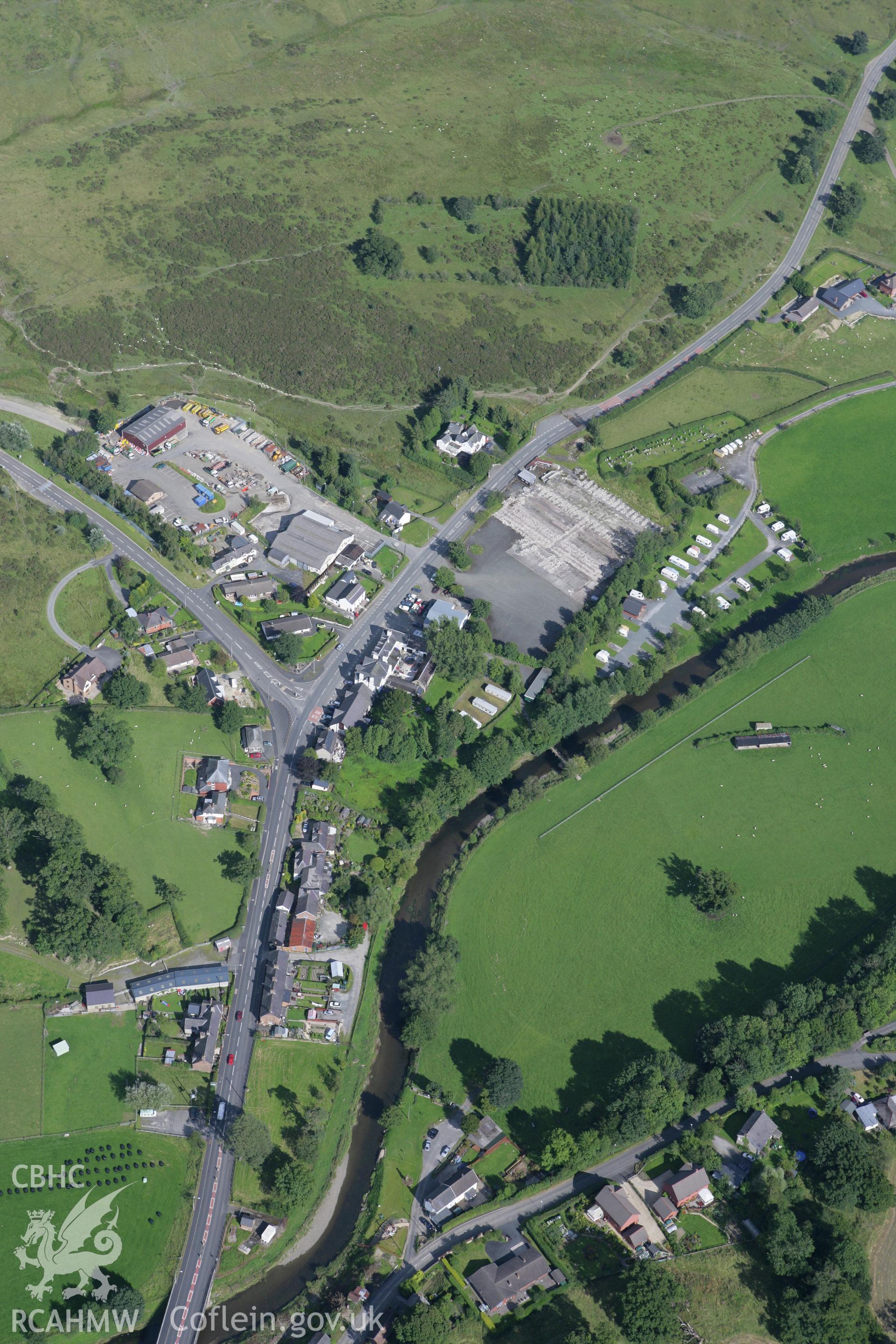 RCAHMW colour oblique aerial photograph of Penybont Village. Taken on 08 August 2007 by Toby Driver