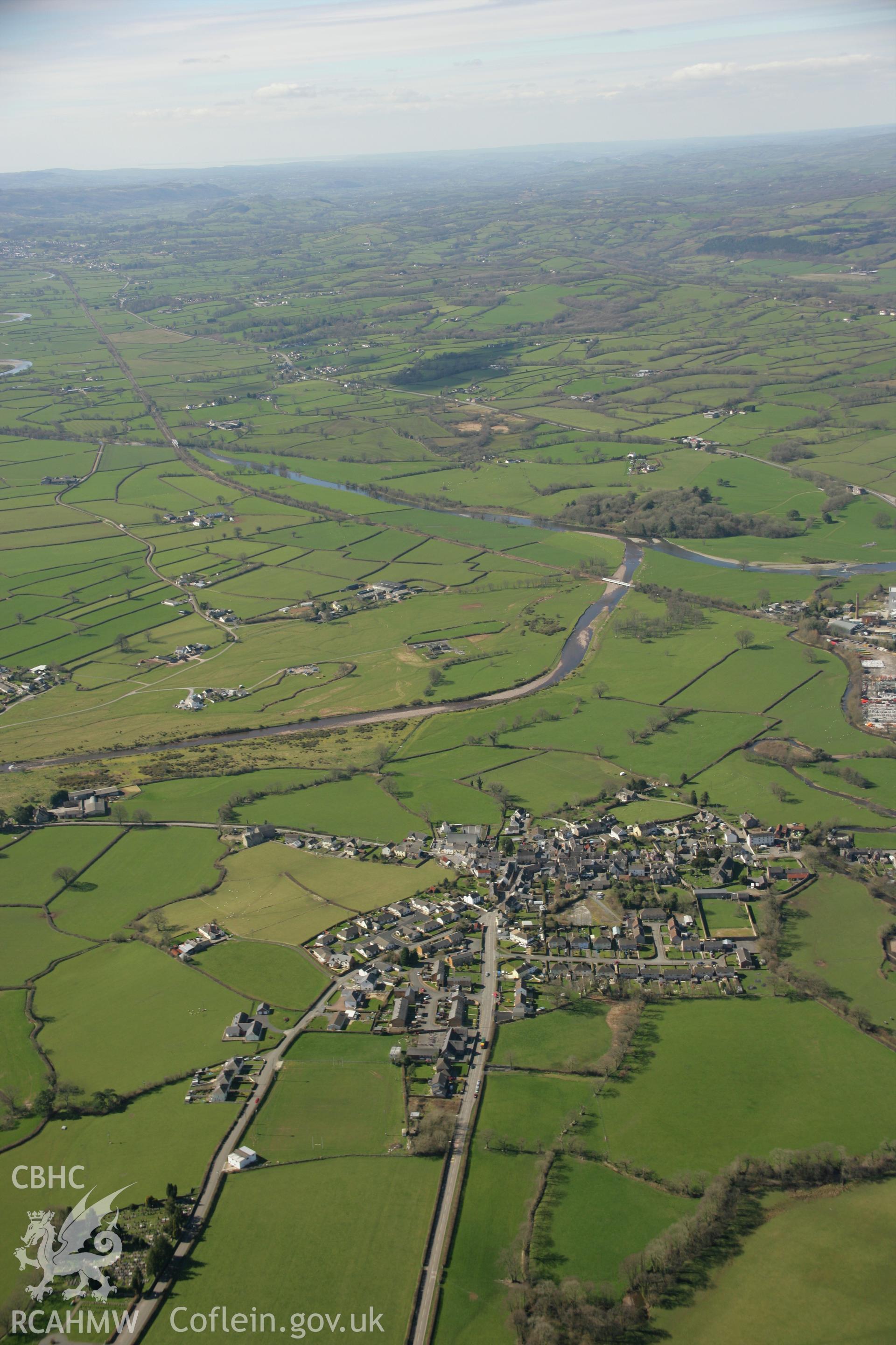 RCAHMW colour oblique aerial photograph of Llangadog town. Taken on 21 March 2007 by Toby Driver